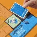 monopoly-go-to-jail-expansion-add-to-classic-monopoly-game-family-games-ages-8-40-mins_4-edit.jpg