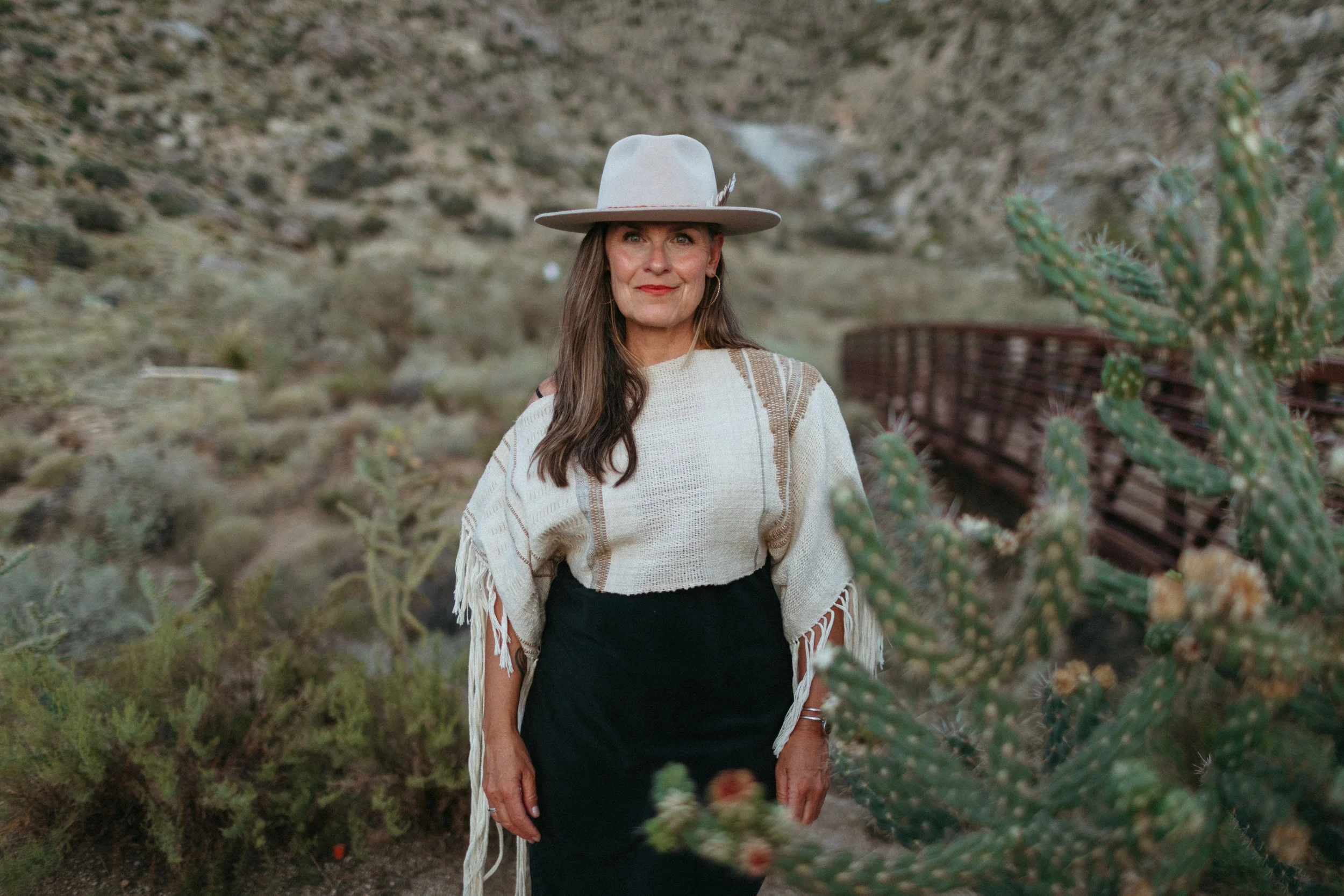 Woman in desert with hat