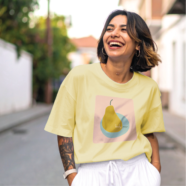 A young woman wearing a box tee with the Wonky Pear print