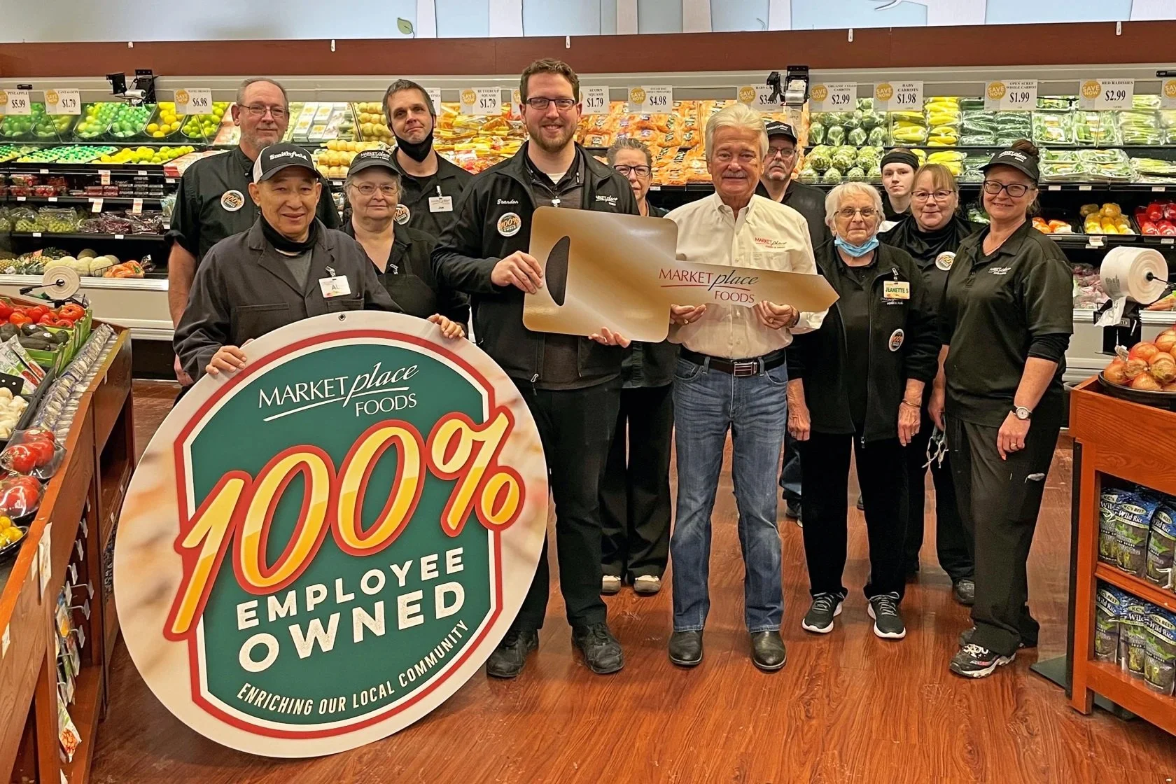 Marketplace employees given keys in celebration of 100% employee ownership