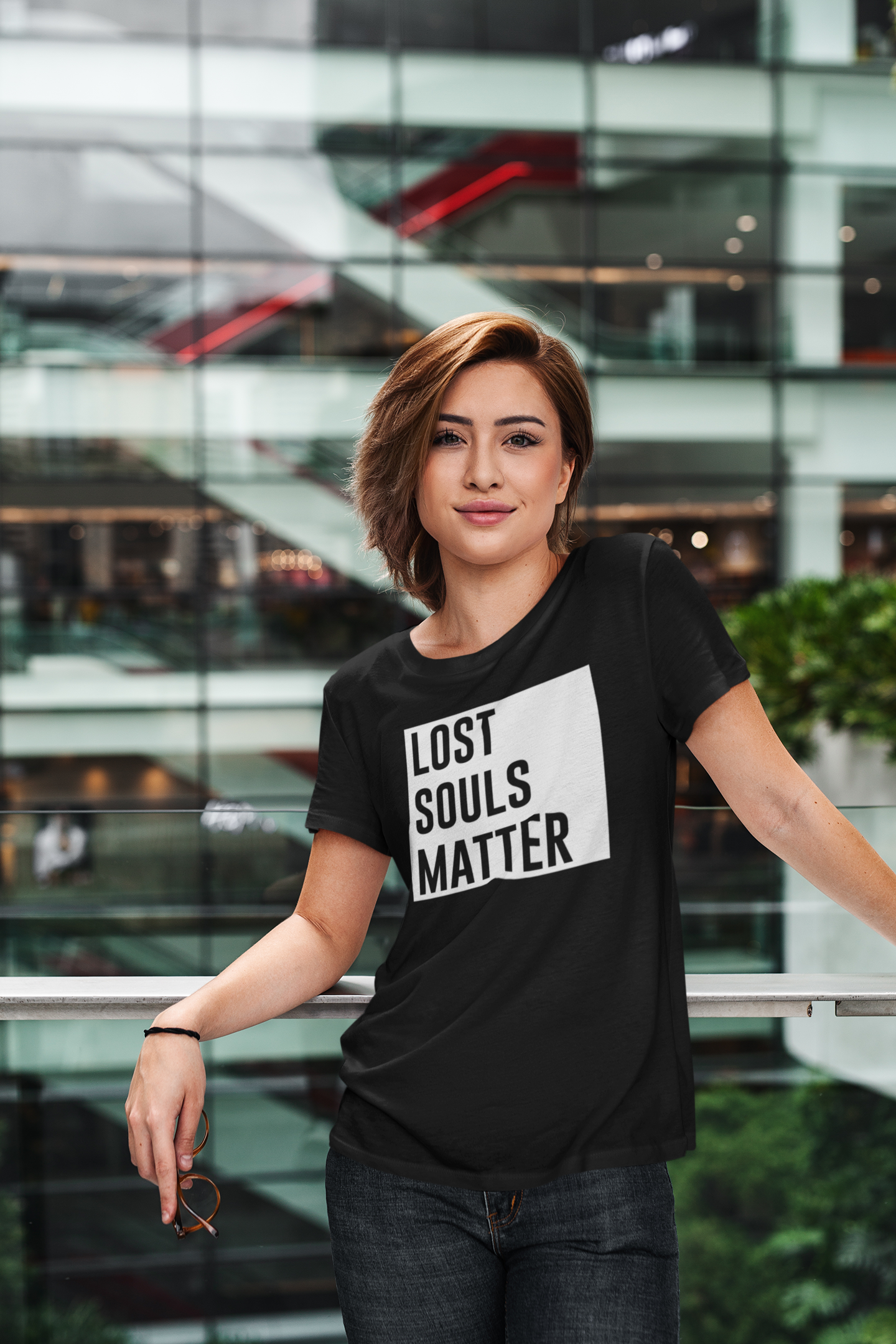 t-shirt-mockup-of-a-cool-woman-in-a-modern-building-414-el.png