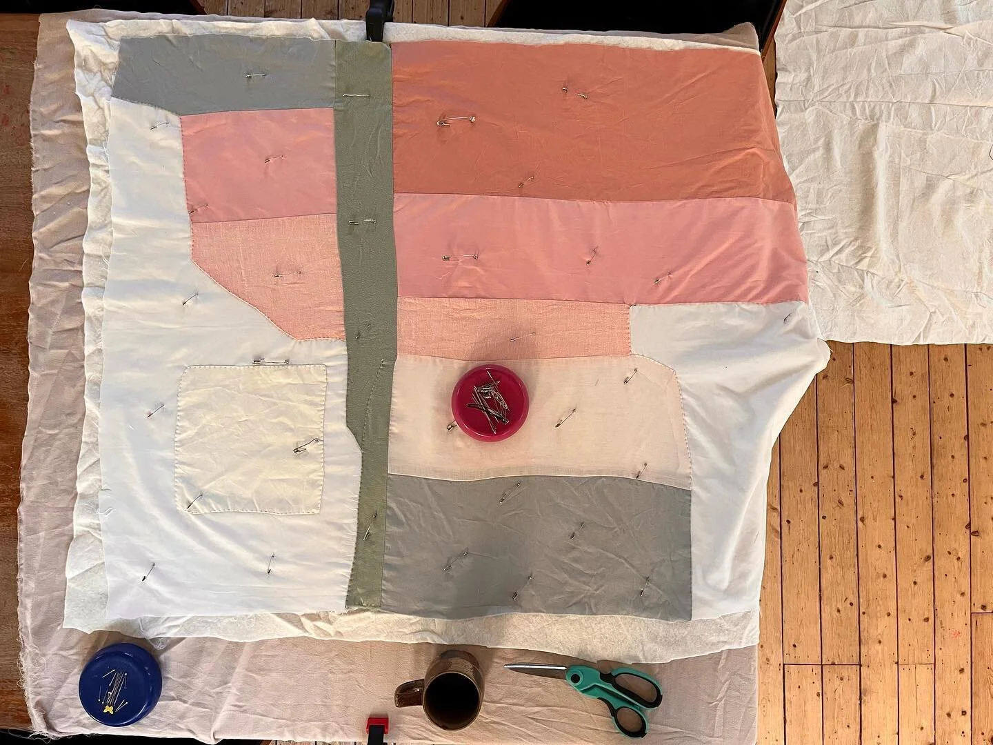 Basting a quilt quick on the kitchen table before 🍳 breakfast