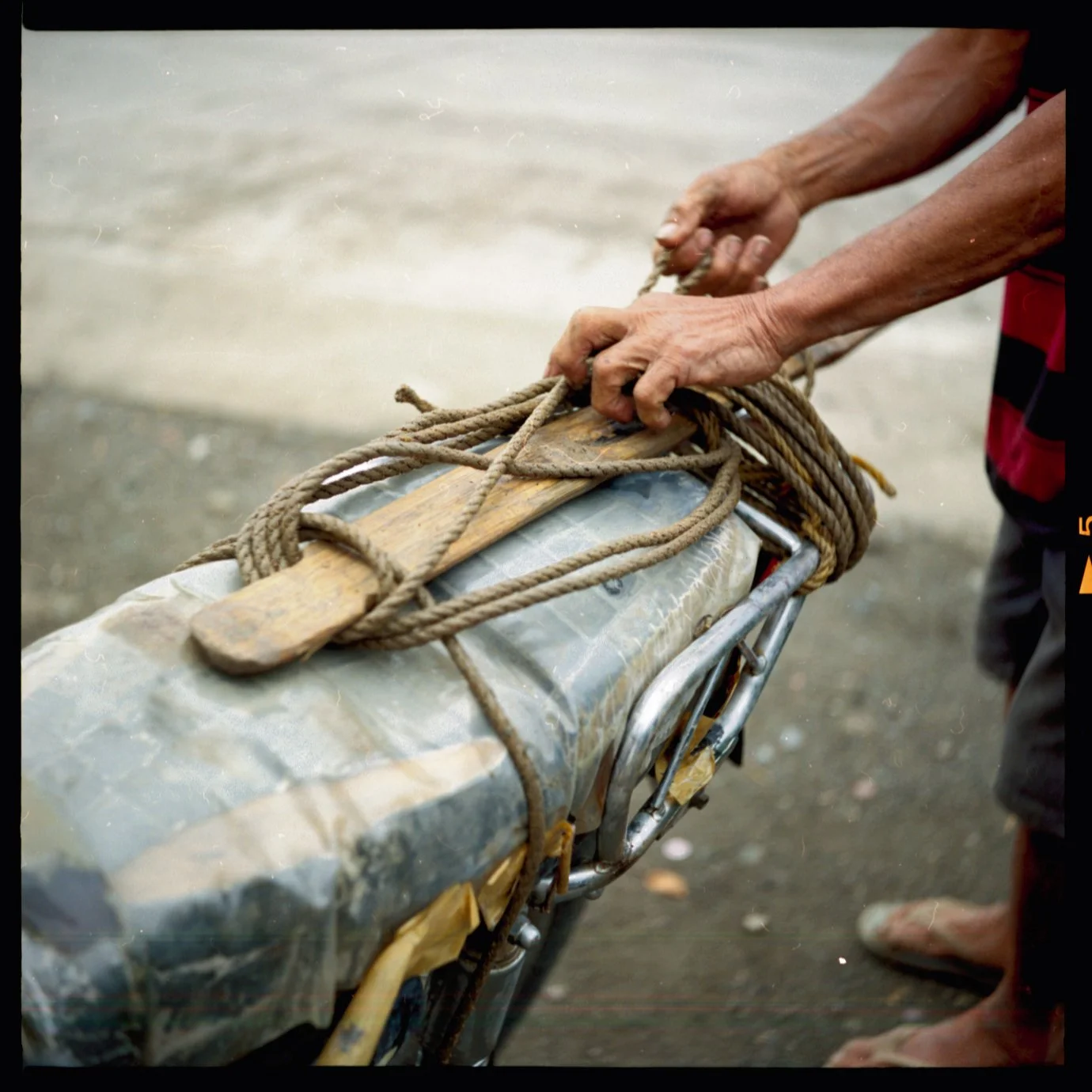  Their village has no running water, so every other day her cousins will strap empty jugs to their motorbike, head over to the next village to fill them up with water, and bring them back. 