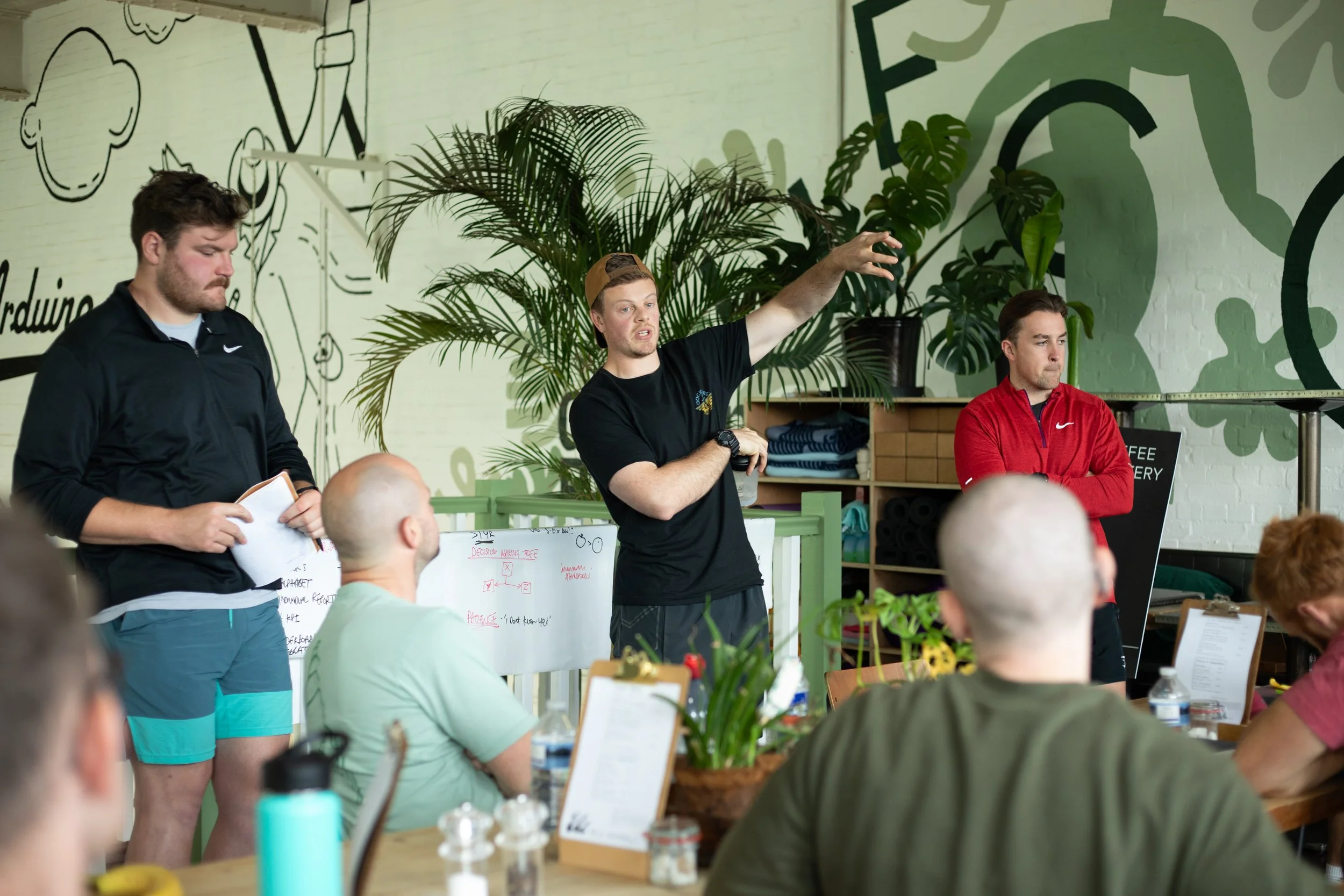 Sports coach having a group conversation with their MDT