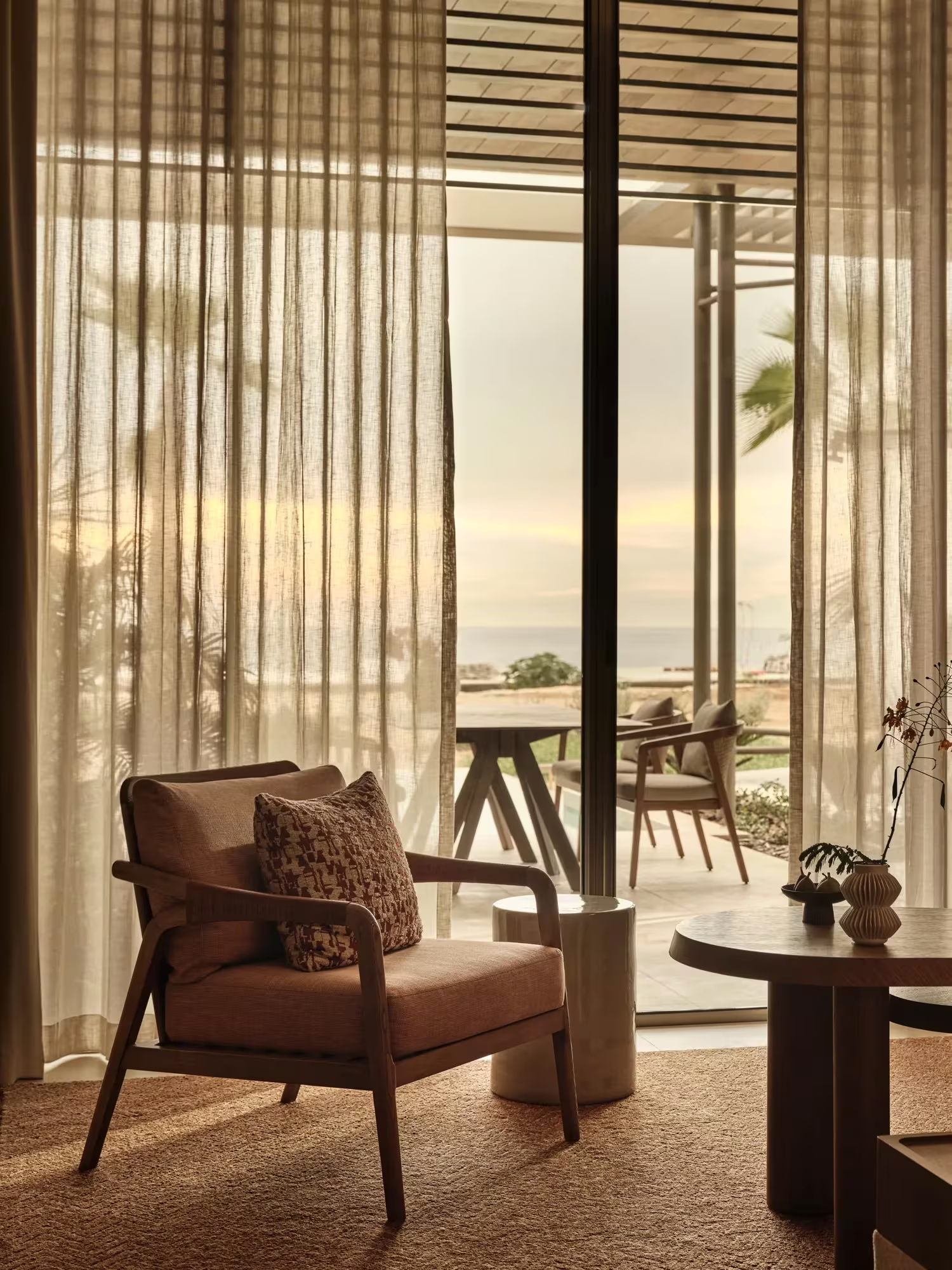 RWAML_Facilities_Room_SeaViewPrivatePoolSuite_LivingRoom.png