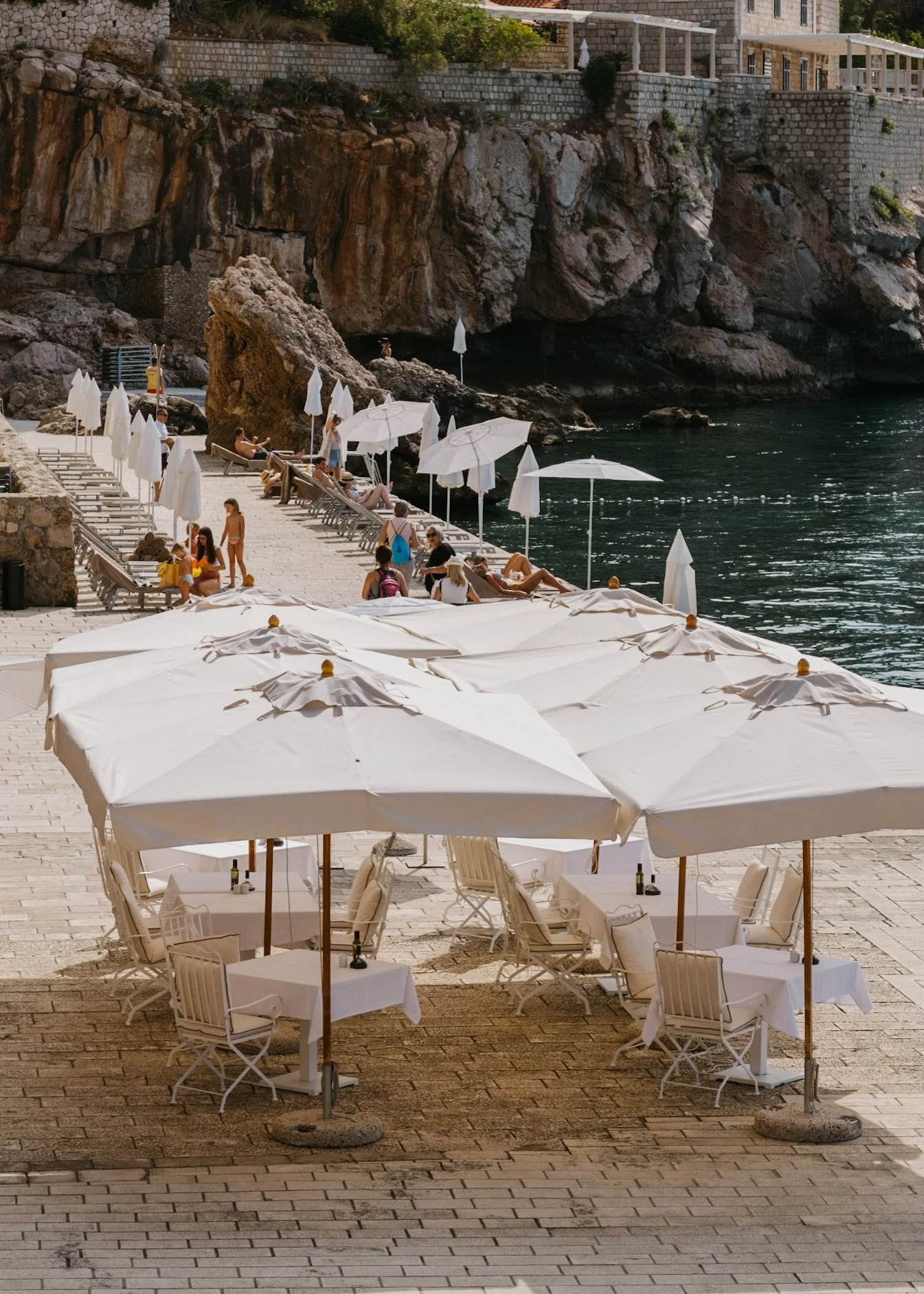 Dubrovnik riviera with white umbrellas