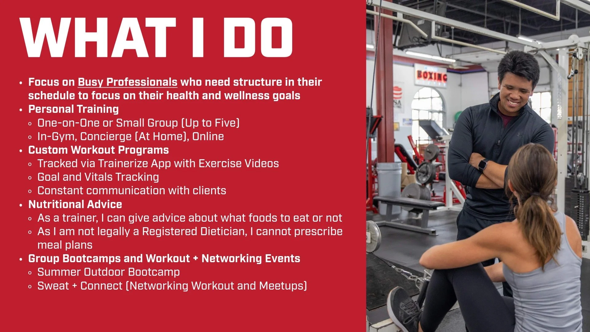 A man and a woman in a gym, the man standing with arms crossed smiling at the woman who is seated on the floor, looking up at him. The gym has workout equipment and a sign that says 'Boxing' in the background.