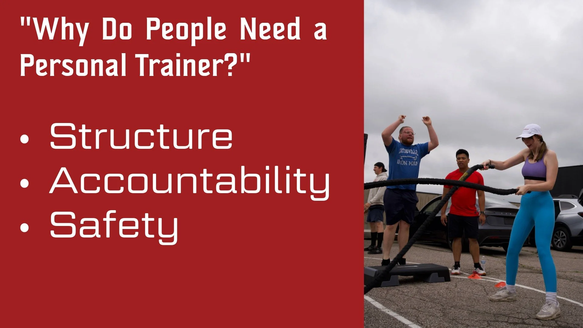 A fitness class outdoors under cloudy skies where a woman in purple and blue workout clothes is pulling battle ropes while three men watch and cheer on.