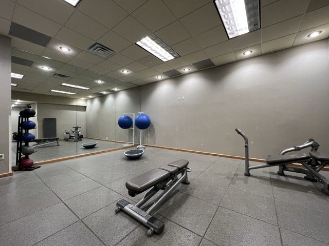 Corner of the Gaylord Texan fitness center, located in Grapevine, TX. Space includes a mirror, medicine balls, and a bench.
