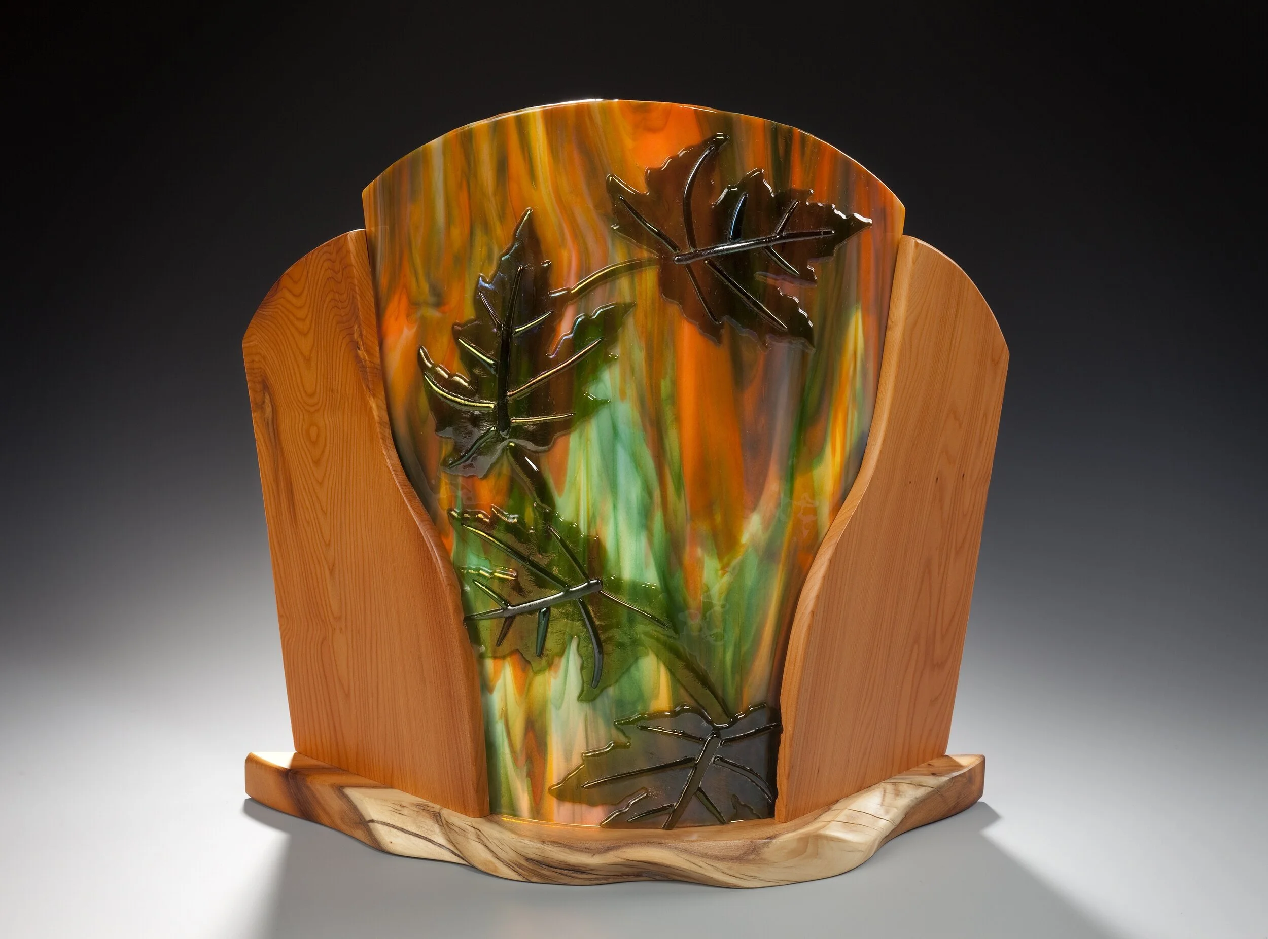 Maple Leaf Sconce,
w/ Yew Wood Frame,
14" w x 11" h, Iridized &
Multi-colored Streaky Glass