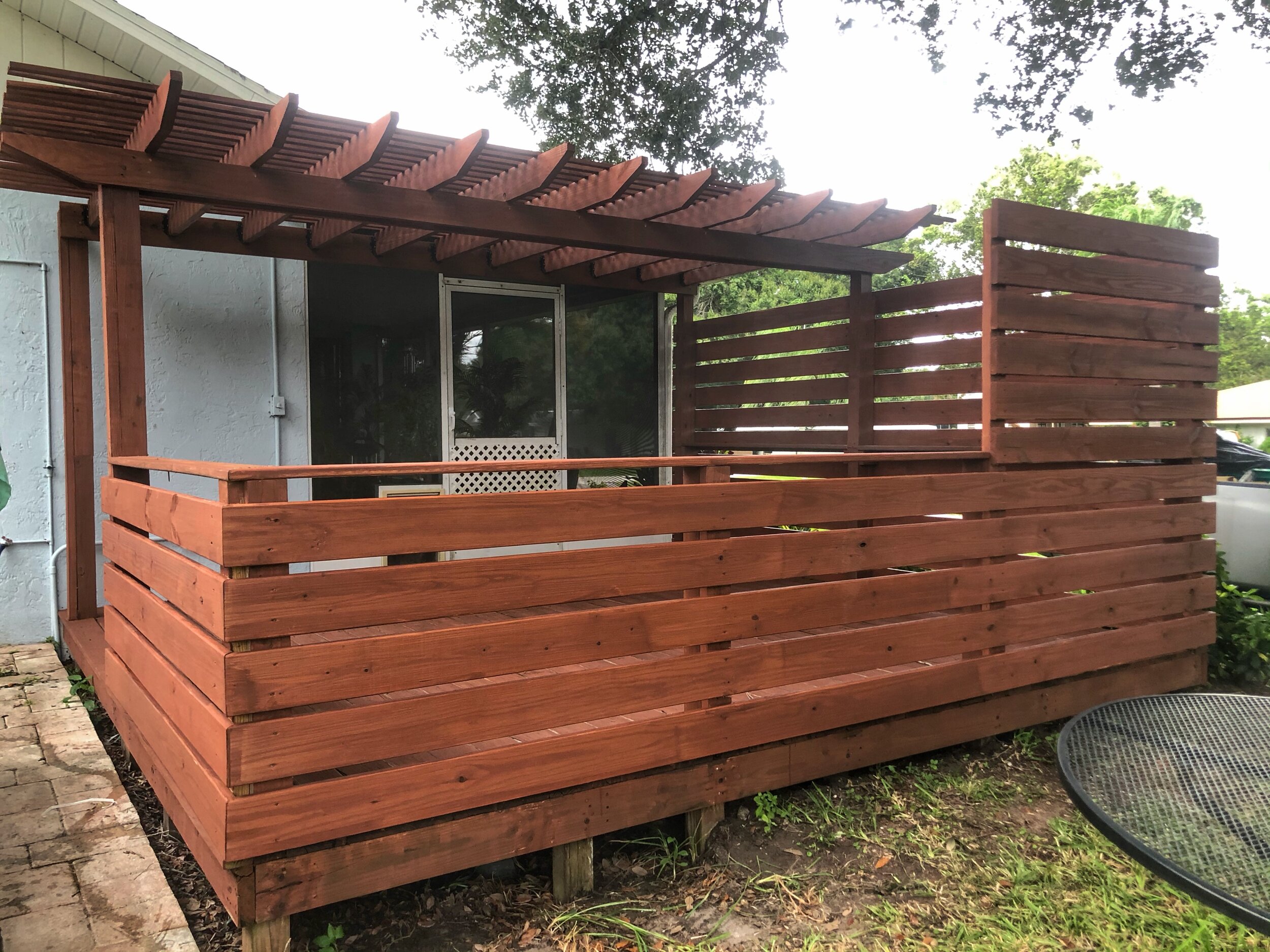 Deck with pergola and privacy fence.jpeg