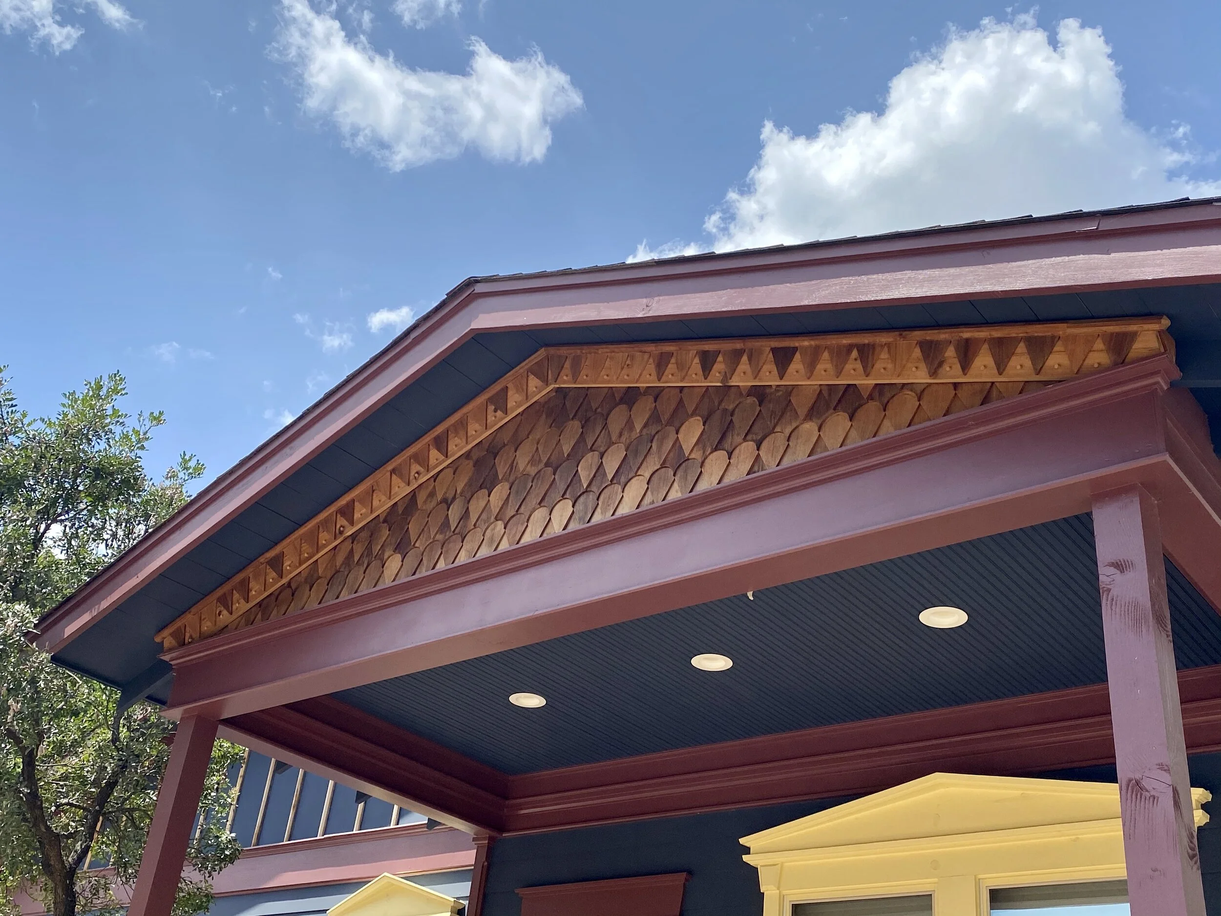 Custom "Dragon scale" cedar pediment with white oak accent