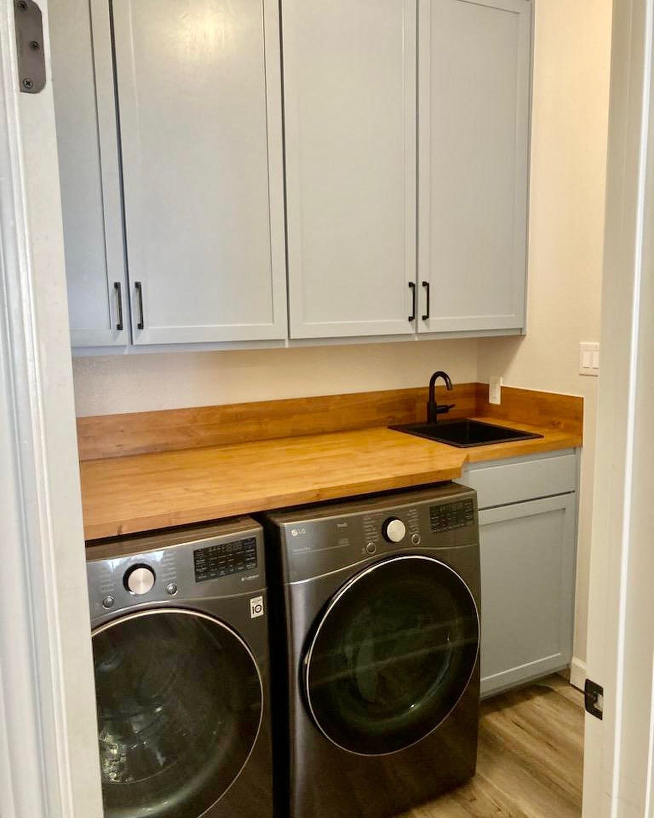 Sneak peek of our latest laundry room remodel; in particular, a fold out step so their kids can use the faucet. Believe it or not, this beautiful mahogany step was built from shop scrap!

#upcyclefurniture #upcycle #customcabinetry #mahogany #mahogan