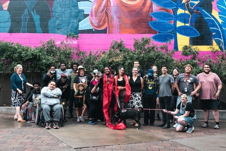 Ribbon cutting at the Cedar Cultural Center mural.