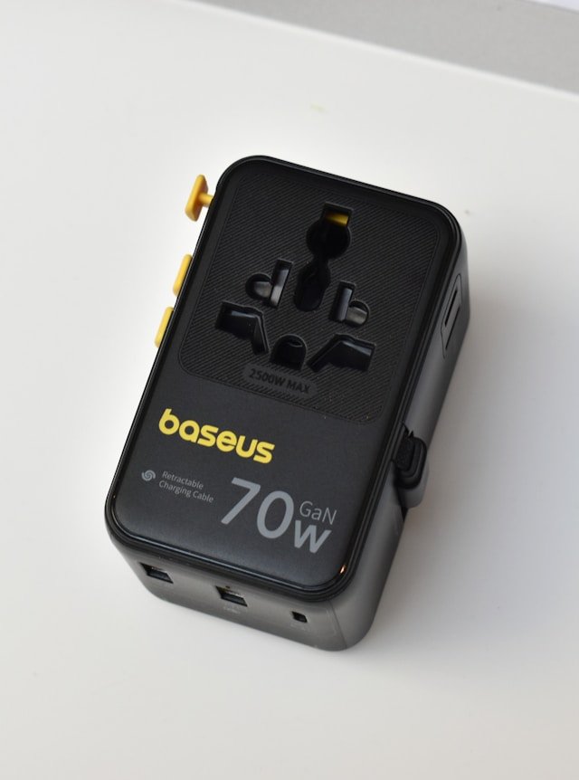 A black global travel power adapter. 