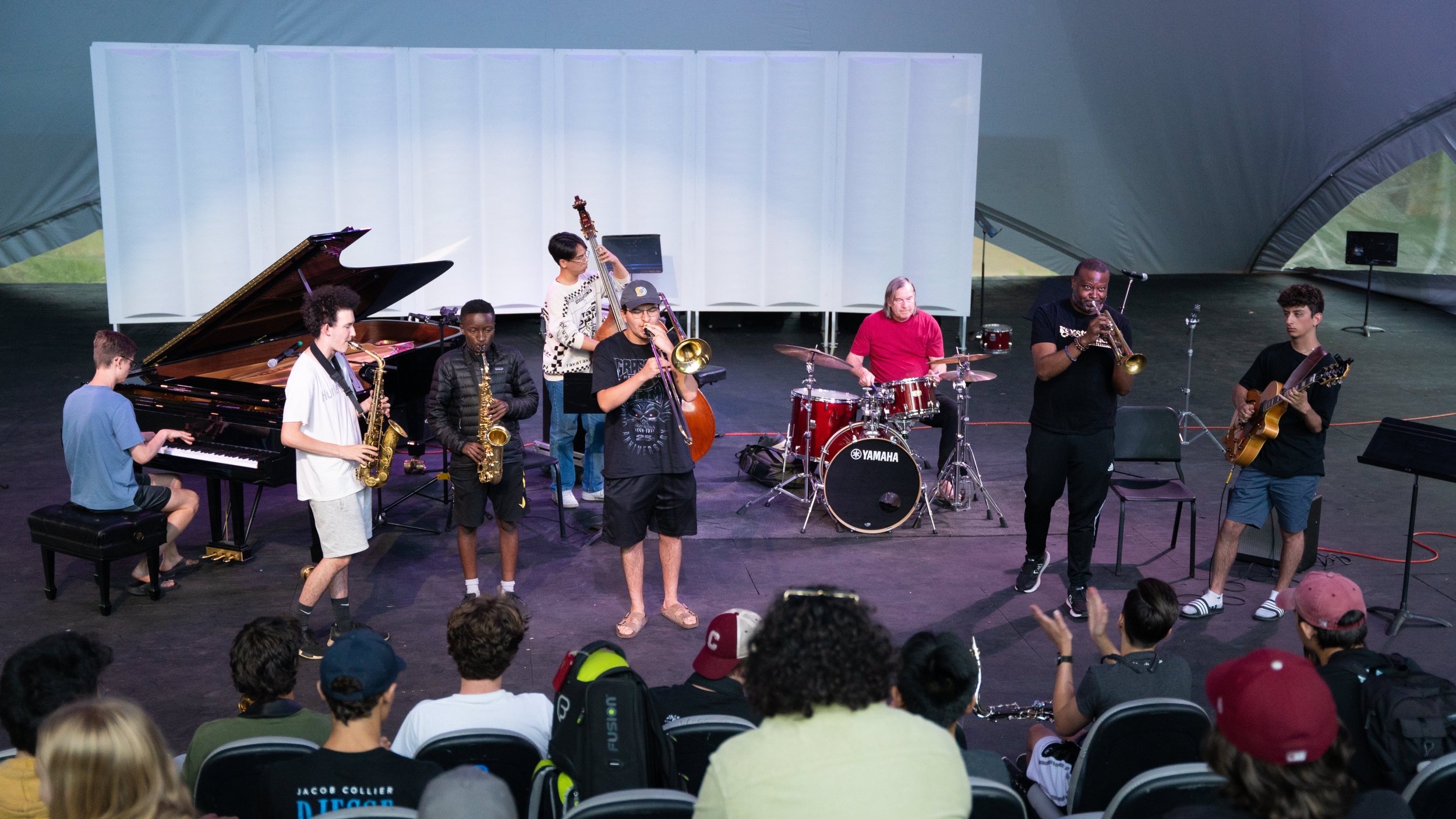   Photo by Austin Kruczek: Dan Brubeck, drums and Sean Jones, trumpet jam with some of the student musicians.  