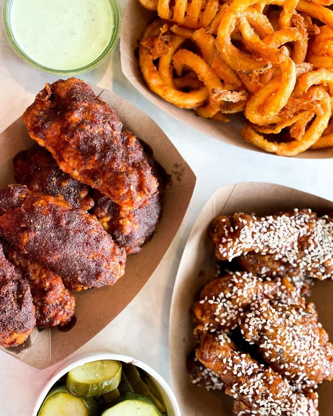 Fuel your weekend with our crispy wings! These saucy suckers are sold by the dozen and can be tossed in your choice of our delicious house-made flavors. Round out the experience with some sides to make it a party!