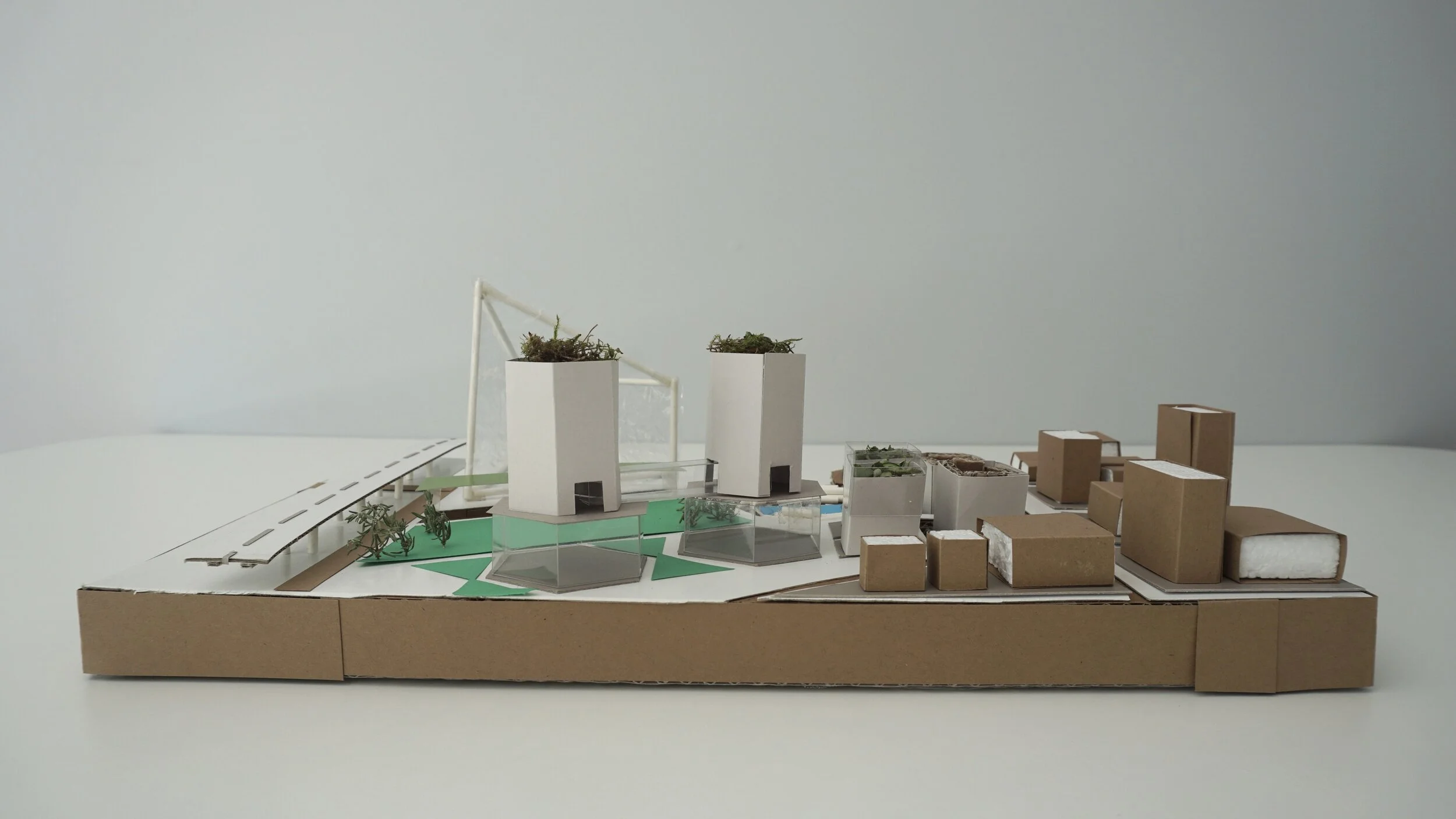 "Geofiguratime Museum" / Concept Site Model at 1:1000 / 10.5 x 16 inches / Cardboard, foamboard, paper, stick, plastic, grass / North Section.