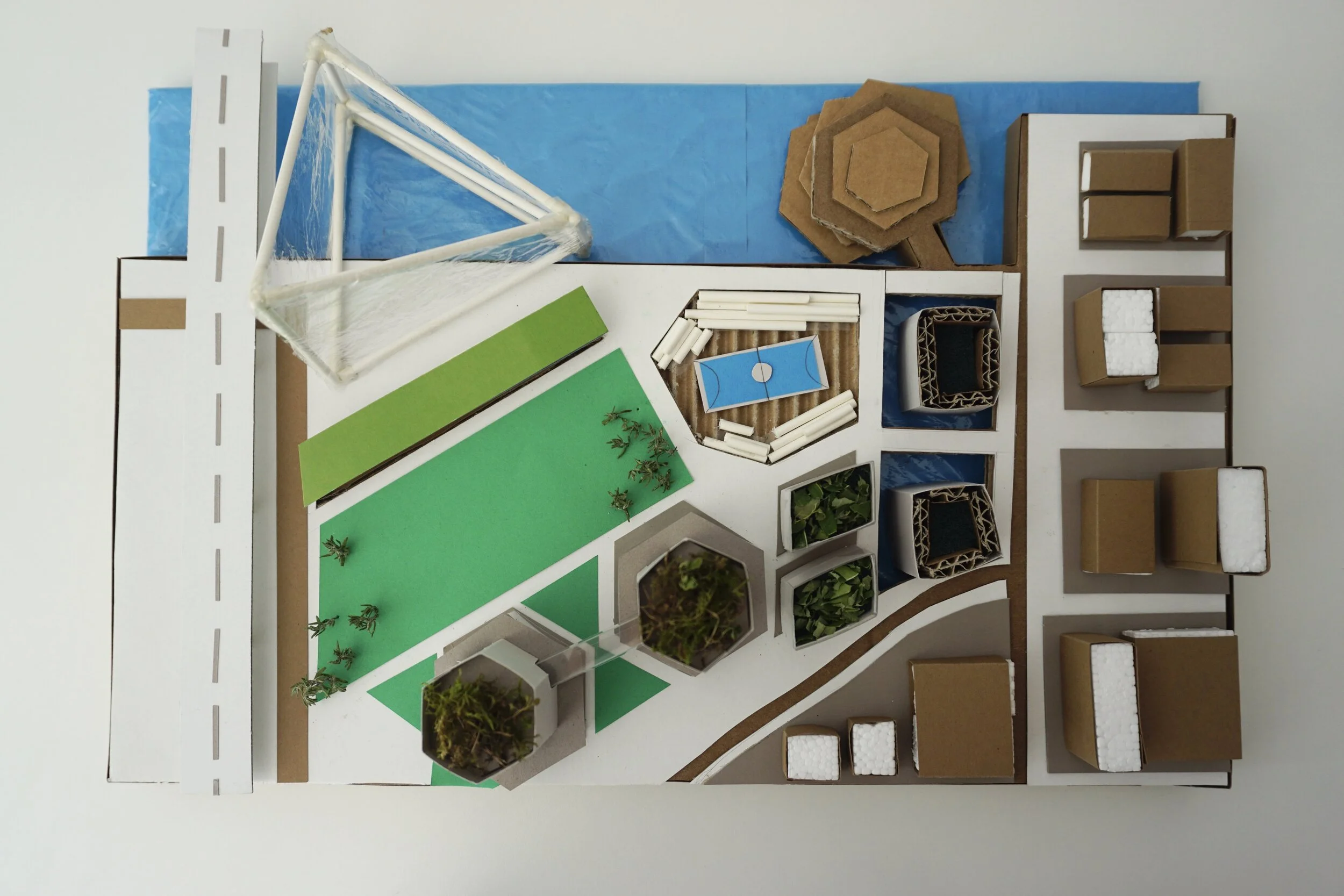 "Geofiguratime Museum" / Concept Site Model at 1:1000 / 10.5 x 16 inches / Cardboard, foamboard, paper, stick, plastic, grass / Top Elevation/
