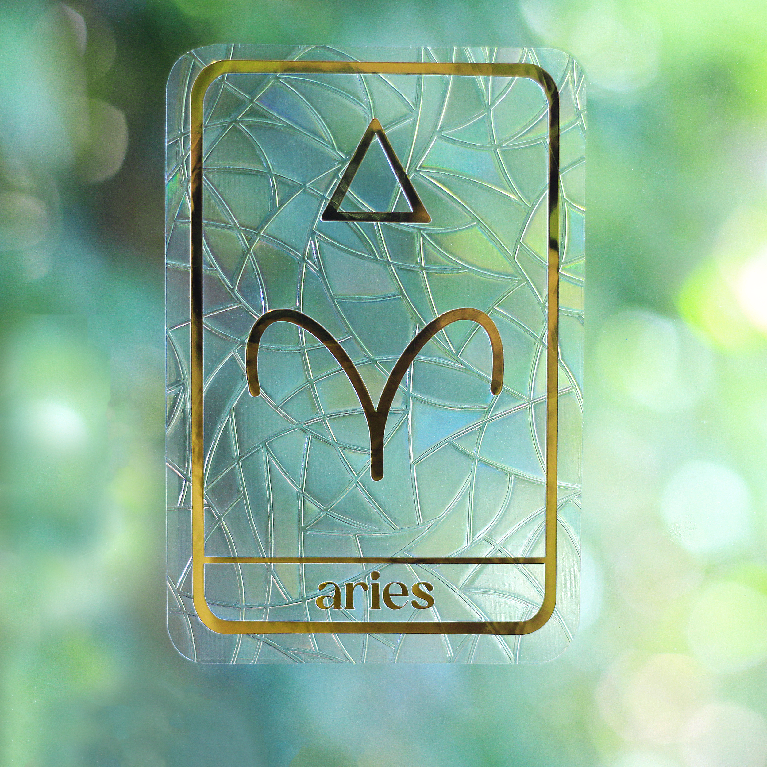 Aries Star Sign Suncatcher On A Window.png