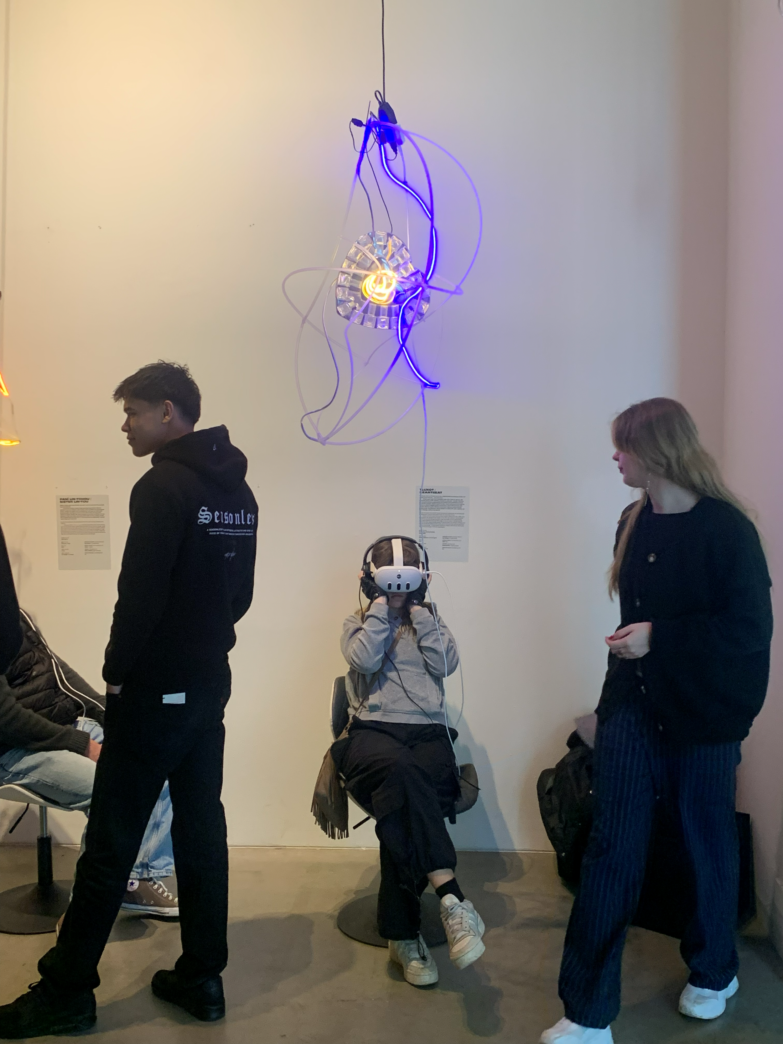 Someone watching Hearteat at the 'Beyond the Glass Ceiling' exhibition, ART*VR 2024.