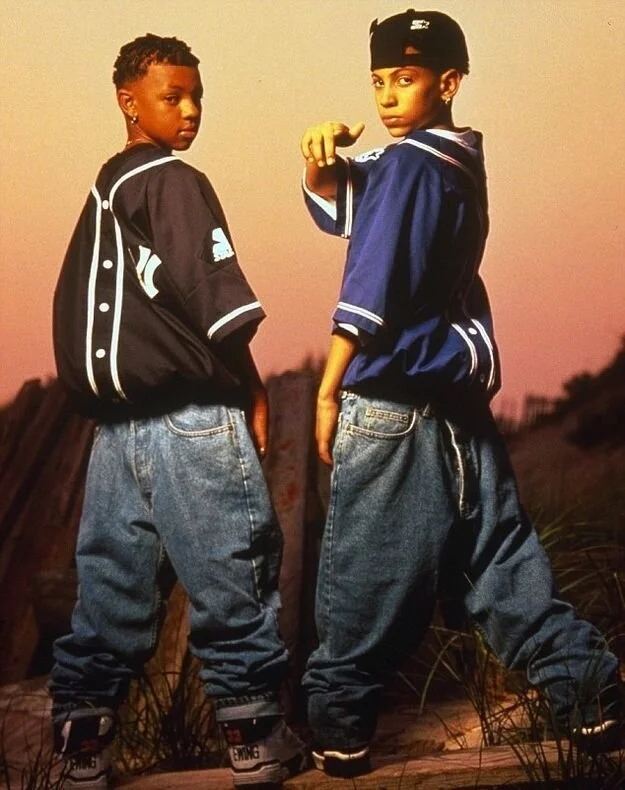 90’s rap duo, Kris Kross, (left) Chris "Daddy Mac" Smith and (right) Chris "Mac Daddy" Kelly.