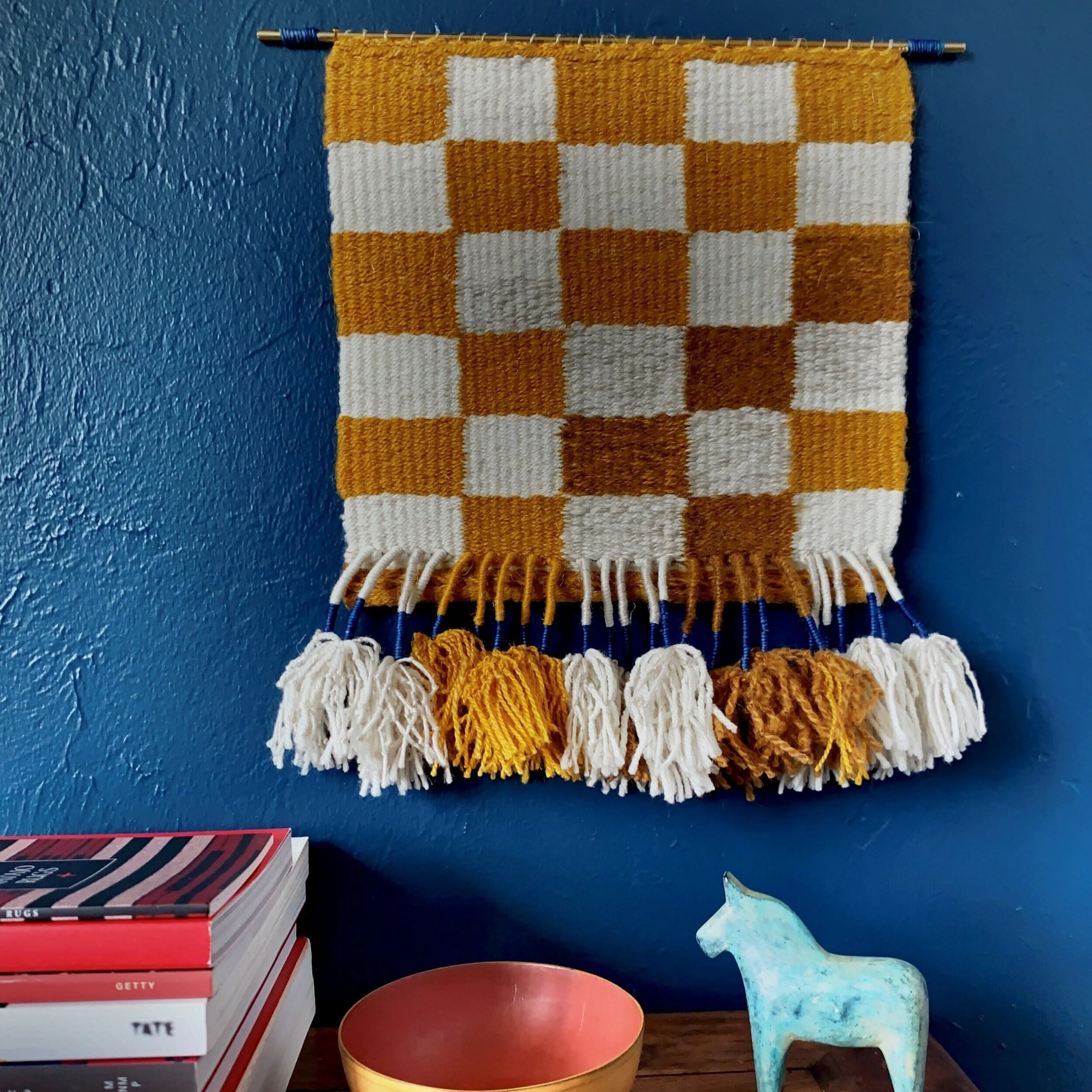 Intense natural color and wrapped fringe create a strong graphic presence in this little tapestry - part of the "Color Study" series. "Ochre Checkerboard"