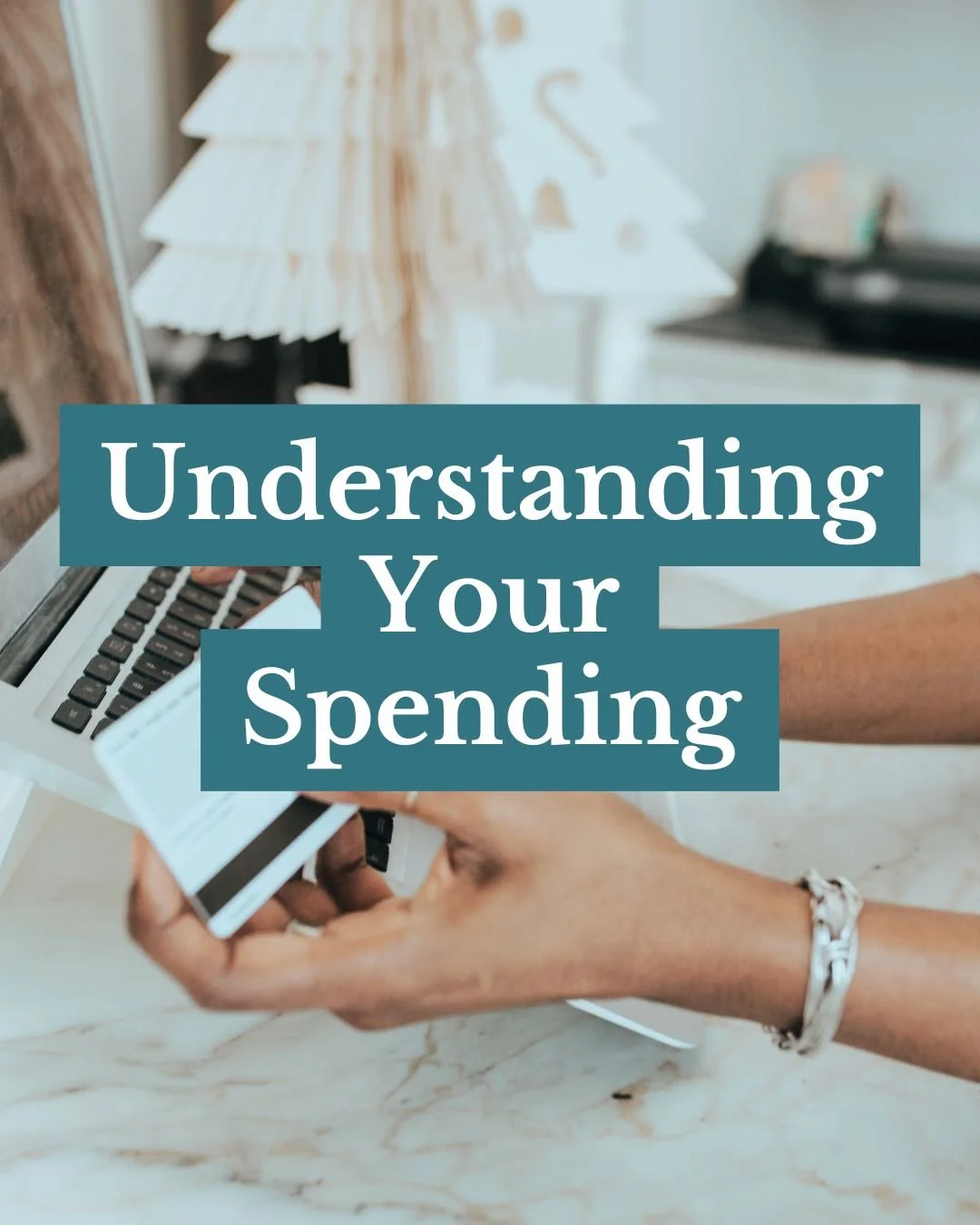 woman holding credit card placing order on laptop to represent the need to understand your spending for emotional spending tips by Mindfully Money Financial Coaching
