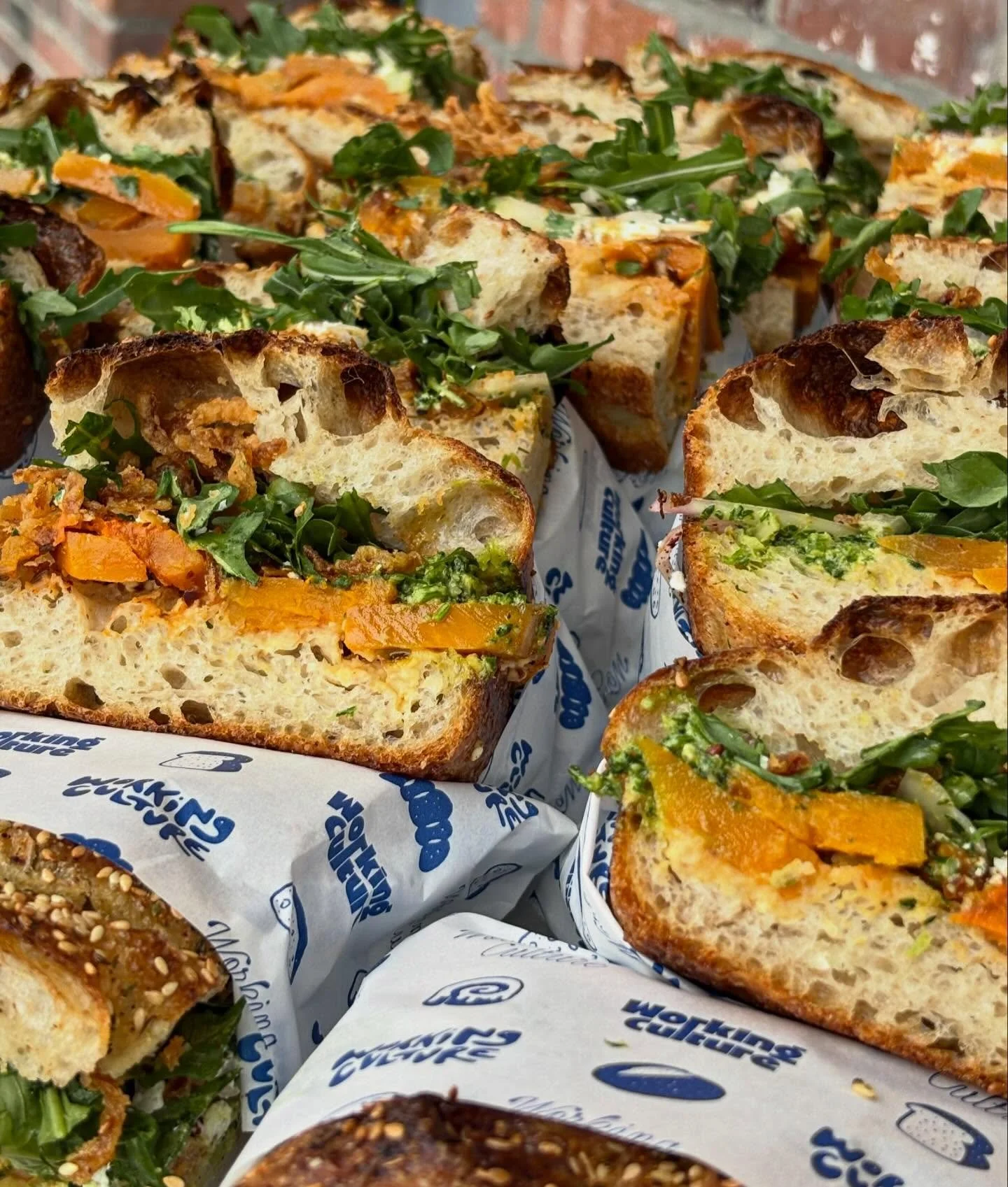 NEW vegetarian sandwich! roasted butternut squash, goat cheese, arugula, crispy onion &amp; sumac white onion, hummus, salsa verde, preserved lemon, on our sourdough focaccia topped with sesame.