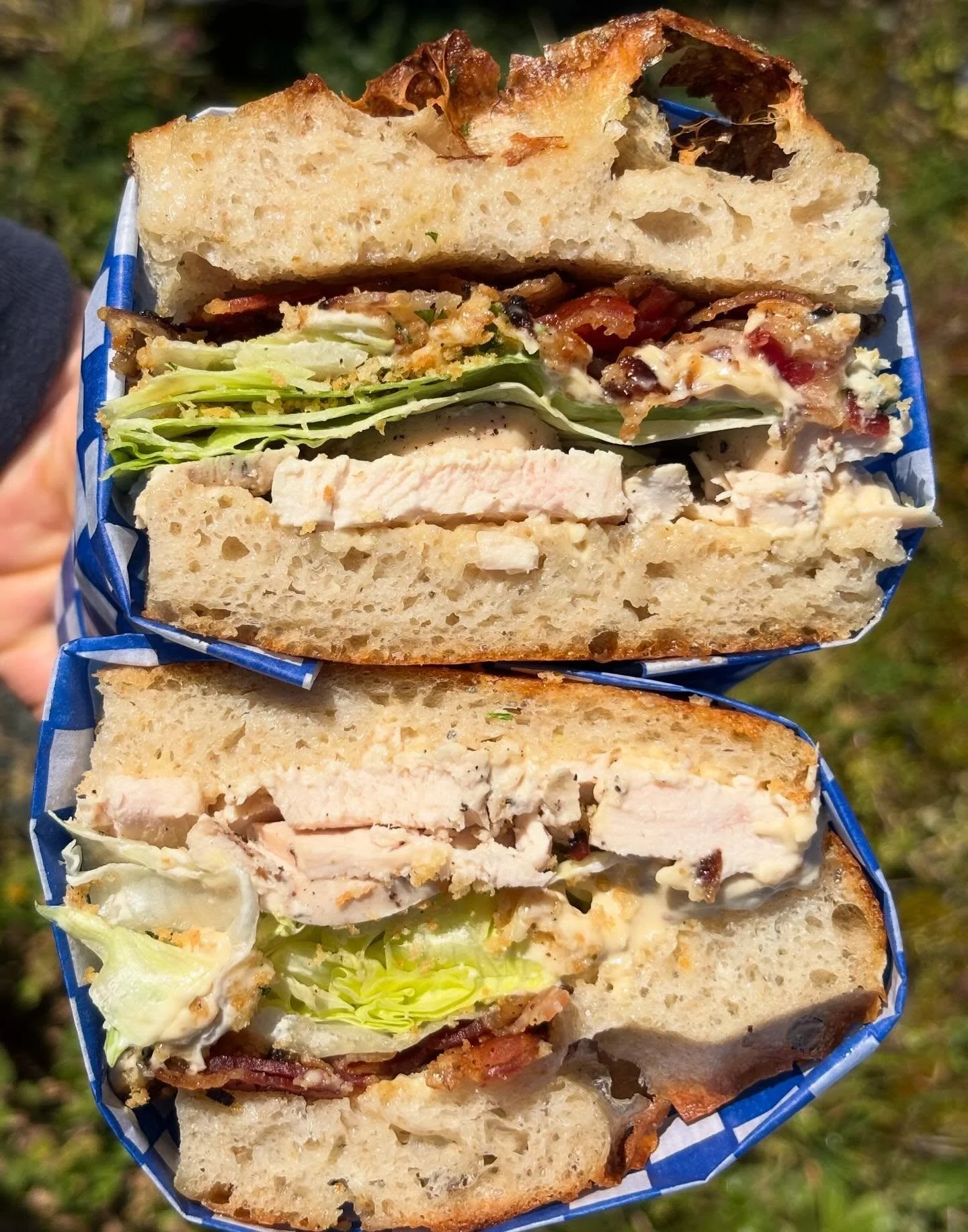 chicken caesar on garlic butter focaccia with peppered bacon shards, garlicky breadcrumbs, iceberg, &amp; anchovy-shallot dressing