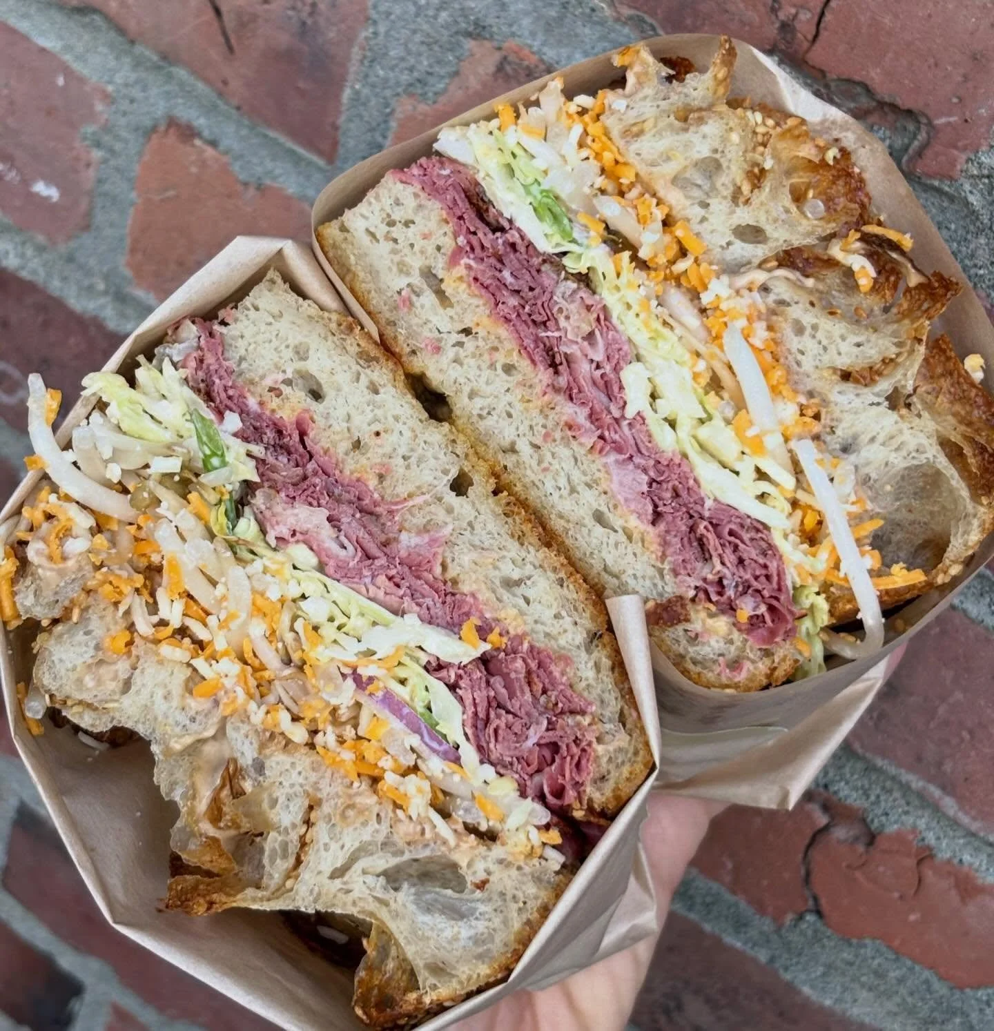 NEW focaccia sandwich on now - Four Quarters smoked beef, kimchi &amp; black garlic mayo, sesame slaw, cheddar. available for grab&amp;go daily from ~10:45am. Call us to set aside any sandwich for pickup.