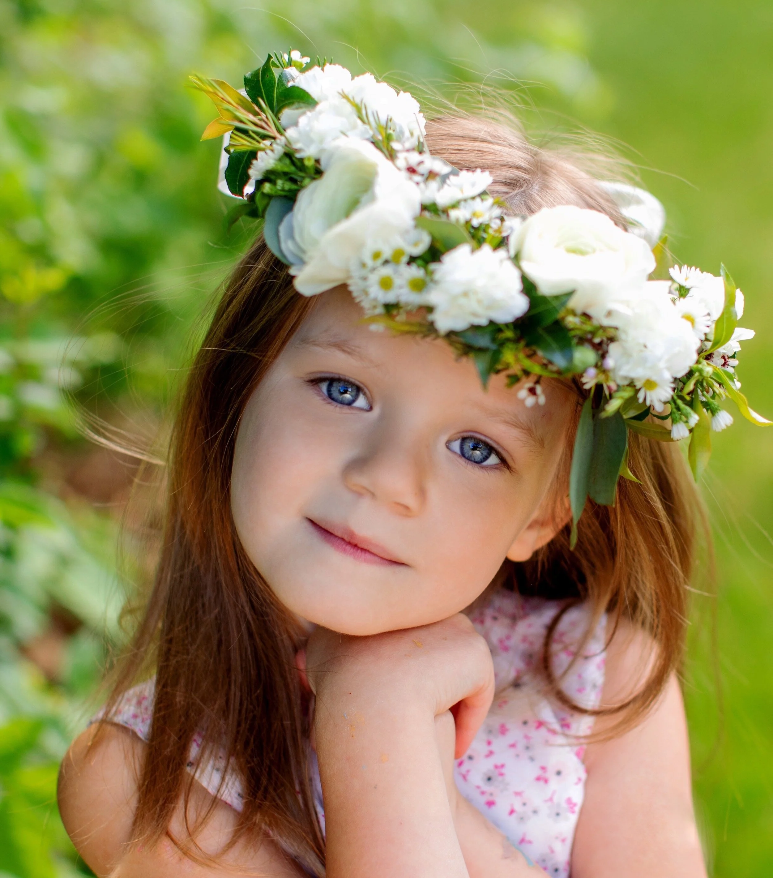 White premium floral crown on young girl with soulful eyes