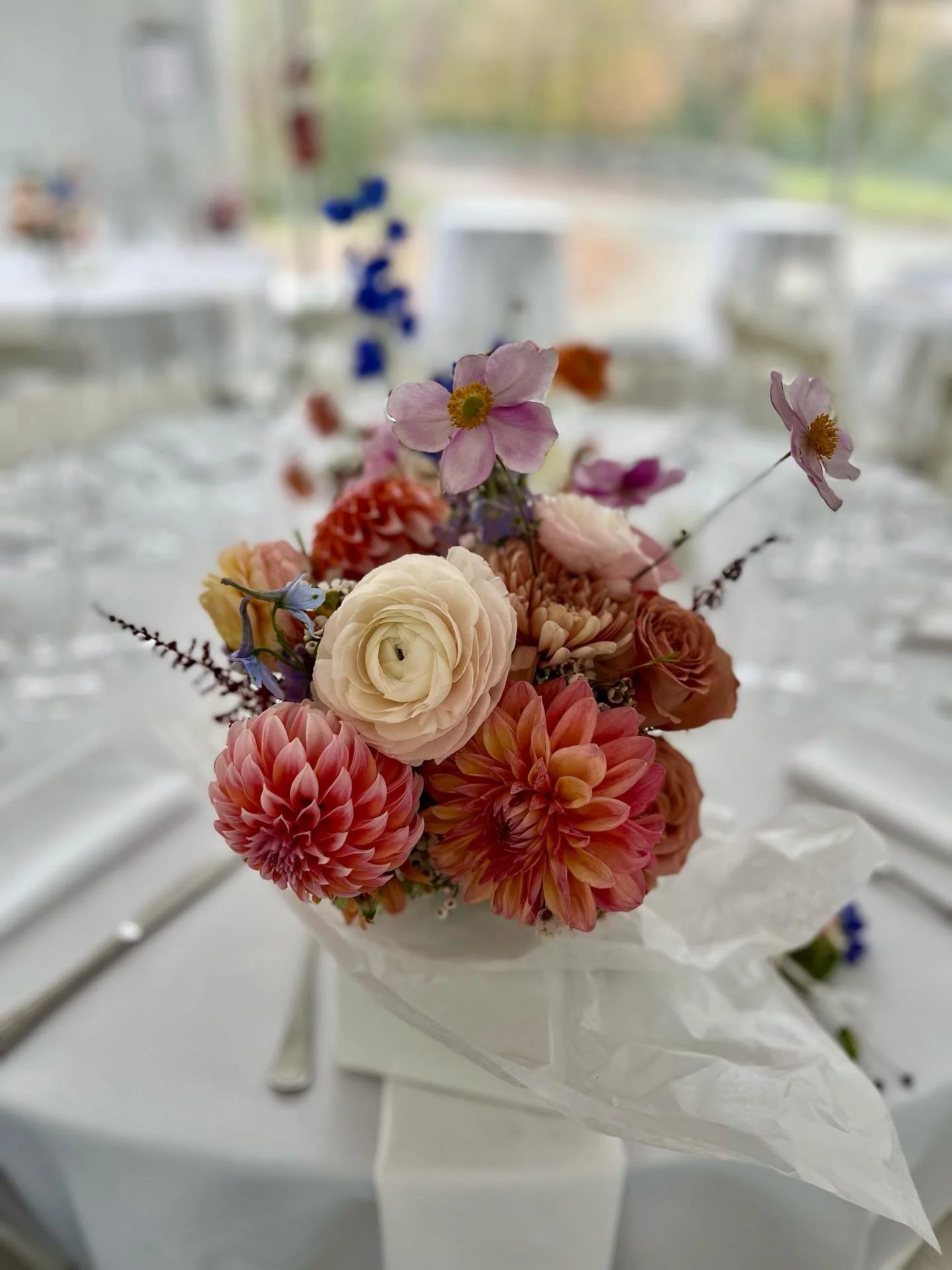 Not every bride wants a giant bouquet. Some brides prefer a more contained, modest bouquet, full of the most delicious flowers. Here we have a variety of dahlias, Cafe Latte  roses, ranunculus, Linette mums, Japanese anemone, and a touch of astilbe a