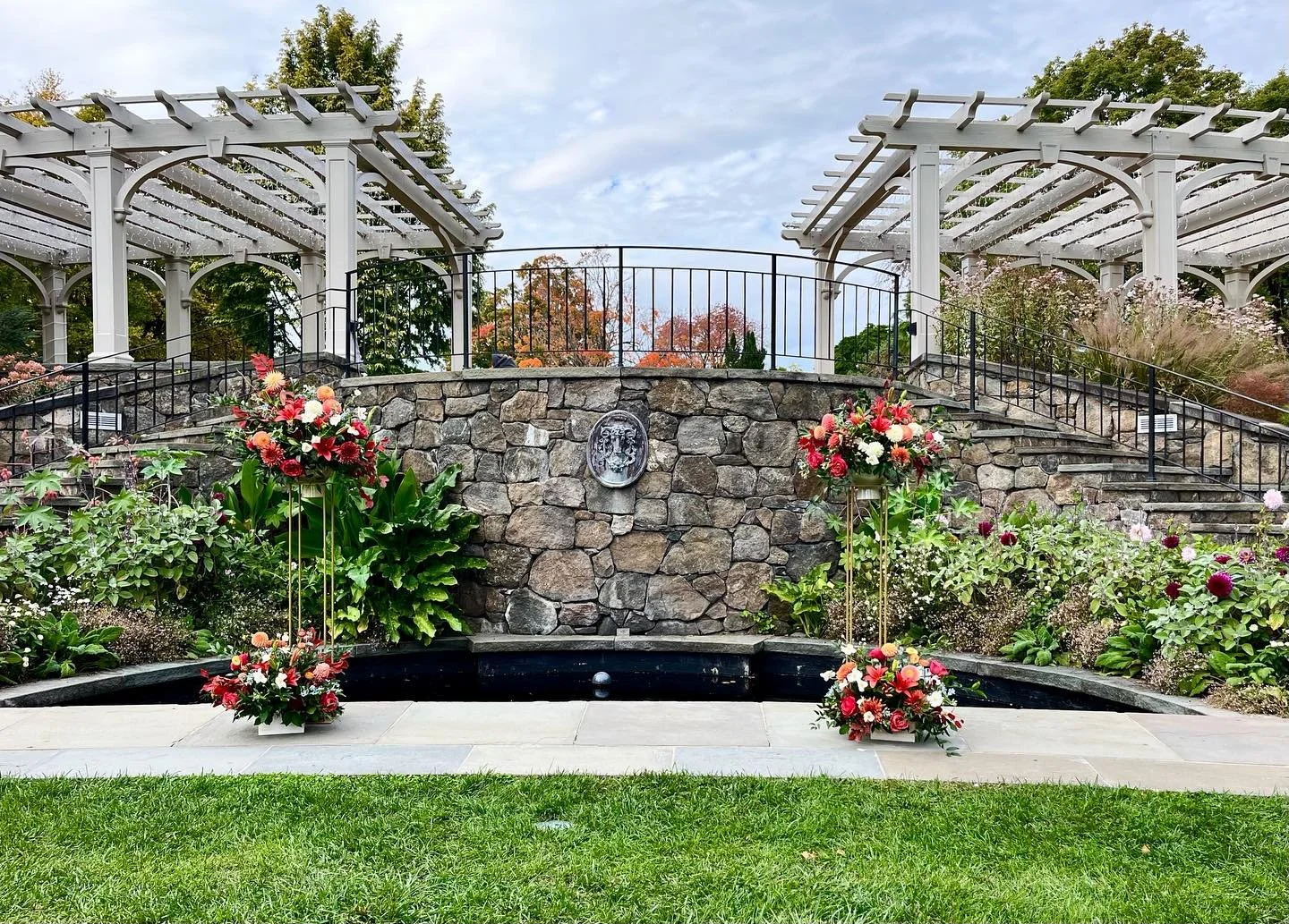 Setting the scene for M to ask S for her hand in marriage last weekend!  Beautiful backdrop in the Secret Garden at New England Botanical Garden. The groom-to-be requested vibrant, autumn flowers in colors that harmonized with the backdrop, but also 