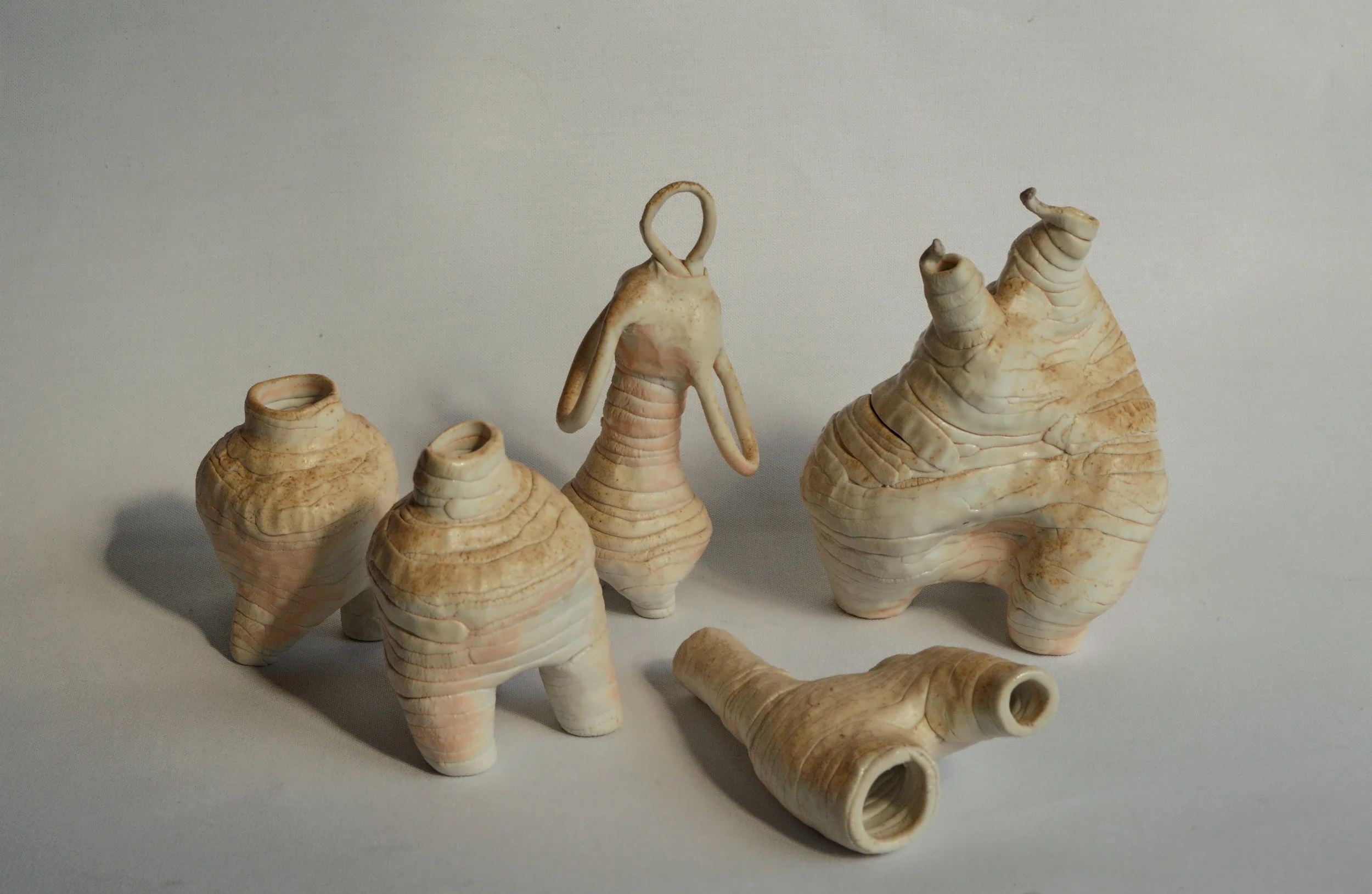 The works function as quiet energy markers, representing the subtle emotional transactions that occur continuously between people, environments, and internal states. Rather than depicting specific symbols, the forms act as abstract talismans for exch