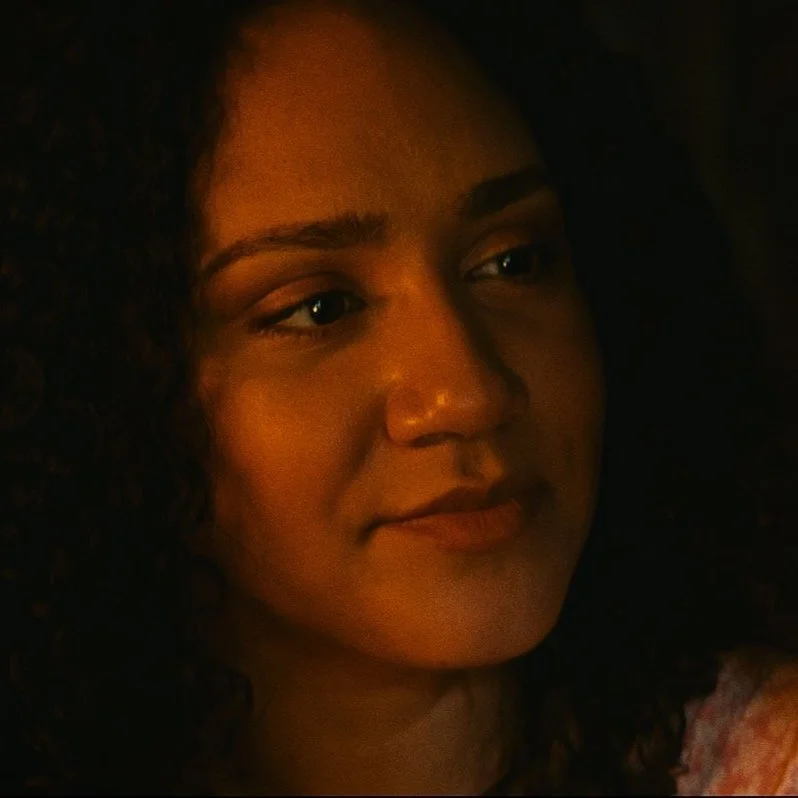 ethereal yet grounded, walks through life with a hopeful glint in her eye, eternally searching for a love that transcends the ordinary. Her laughter rings with innocence, her sorrow, a silent echo of past wounds. She's a mosaic of dreams and fears, e