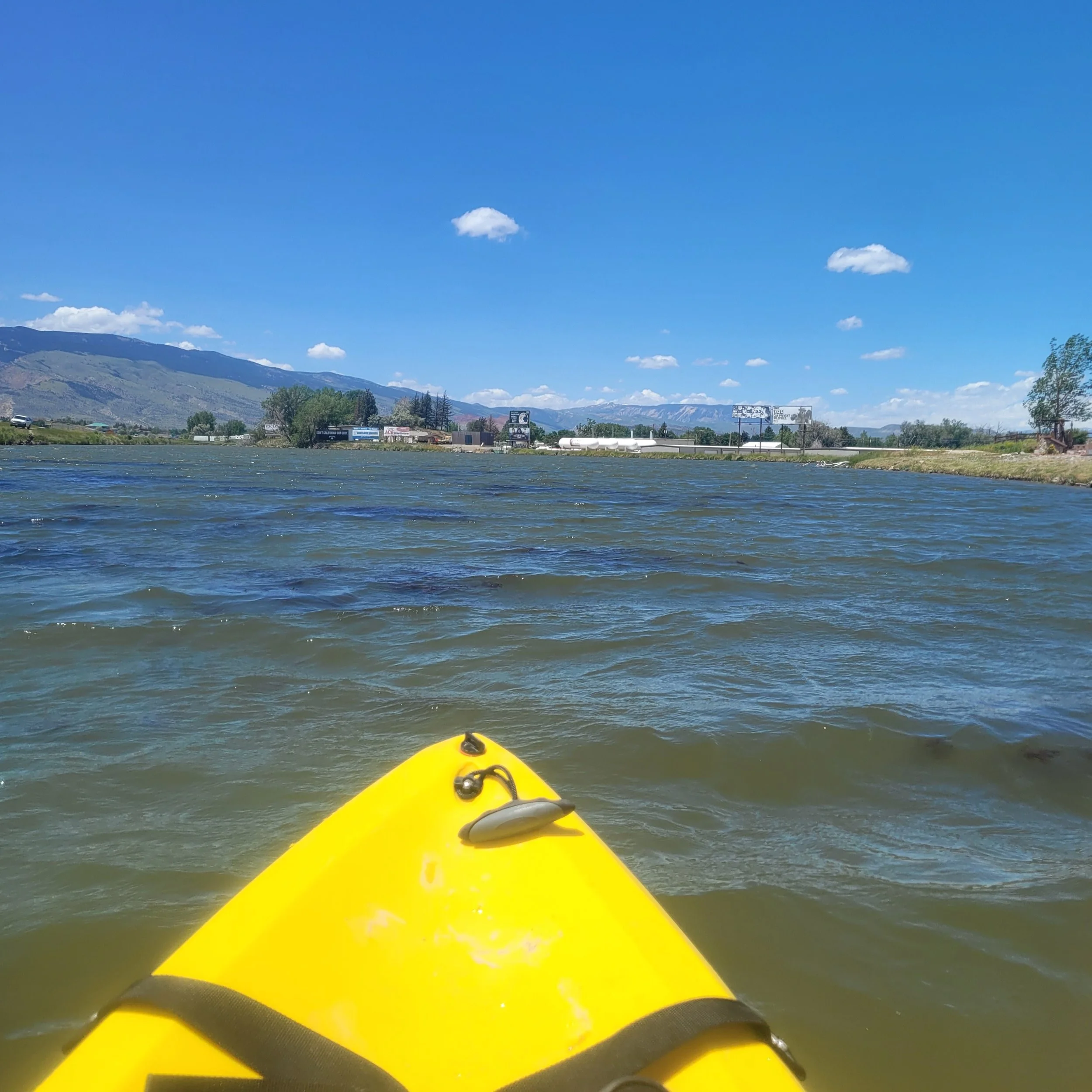 Paddleboard on windy lake in Cody, Wyoming