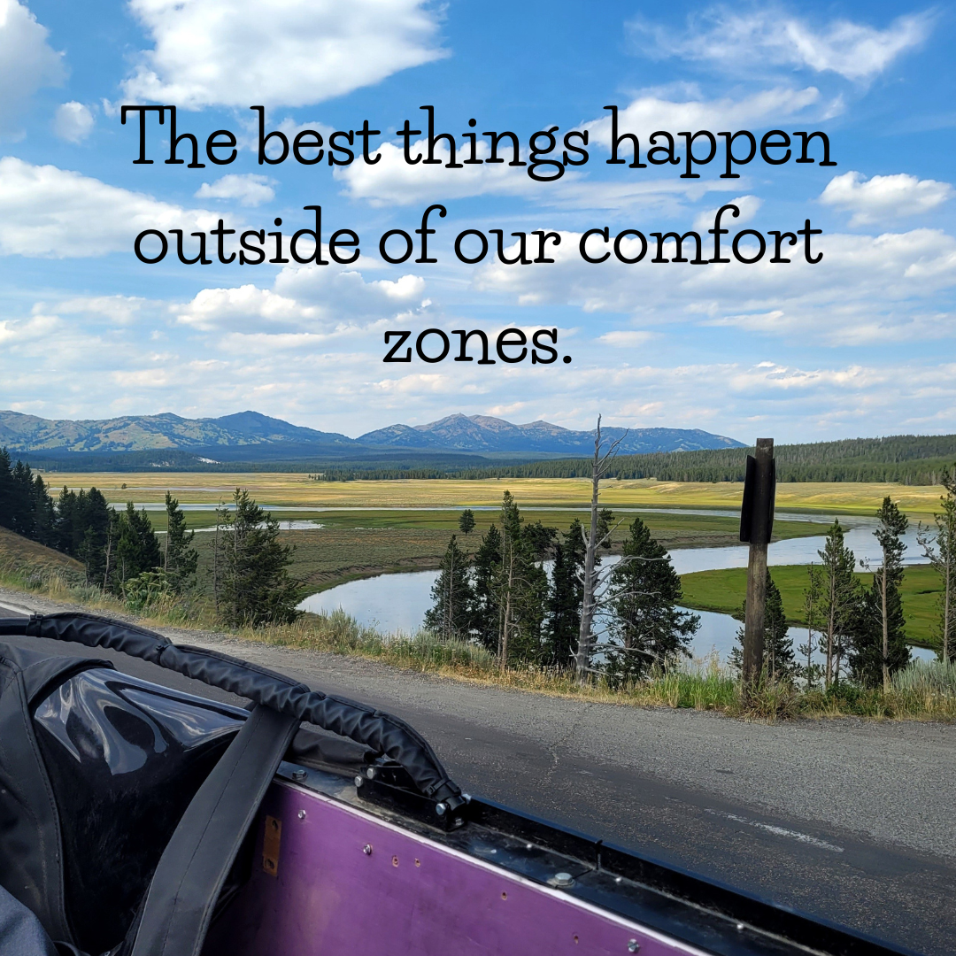 Scenic view of mountains, grasslands, and a winding river with a motivational quote, "The best things happen outside of our comfort zones."