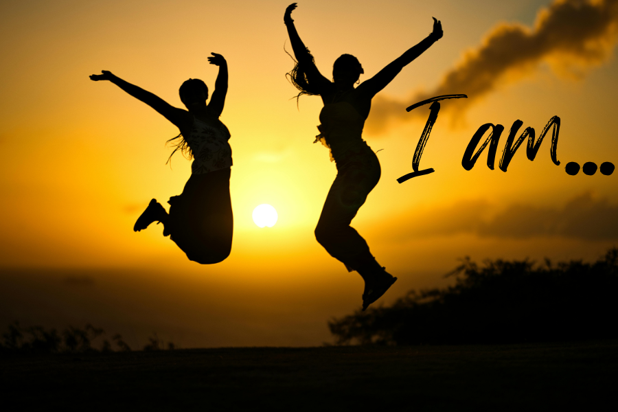 Two people jumping in the air with joy