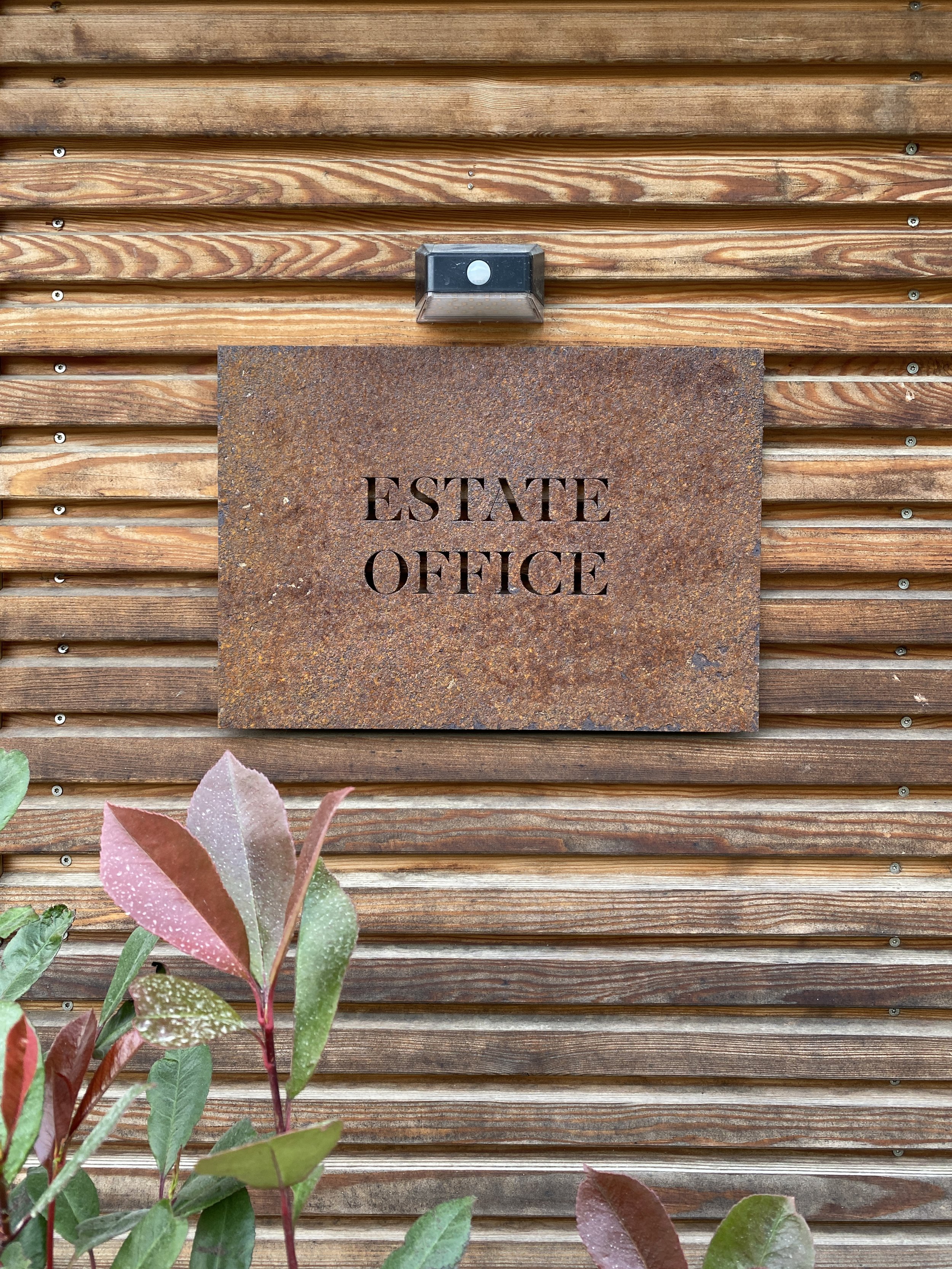 External signage in laser cut steel left to oxidise