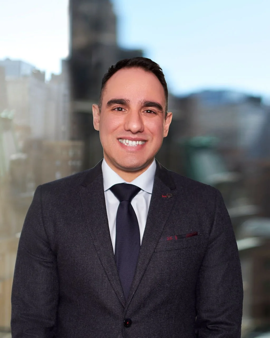 Handsome white male therapist smiling in professional headshot.