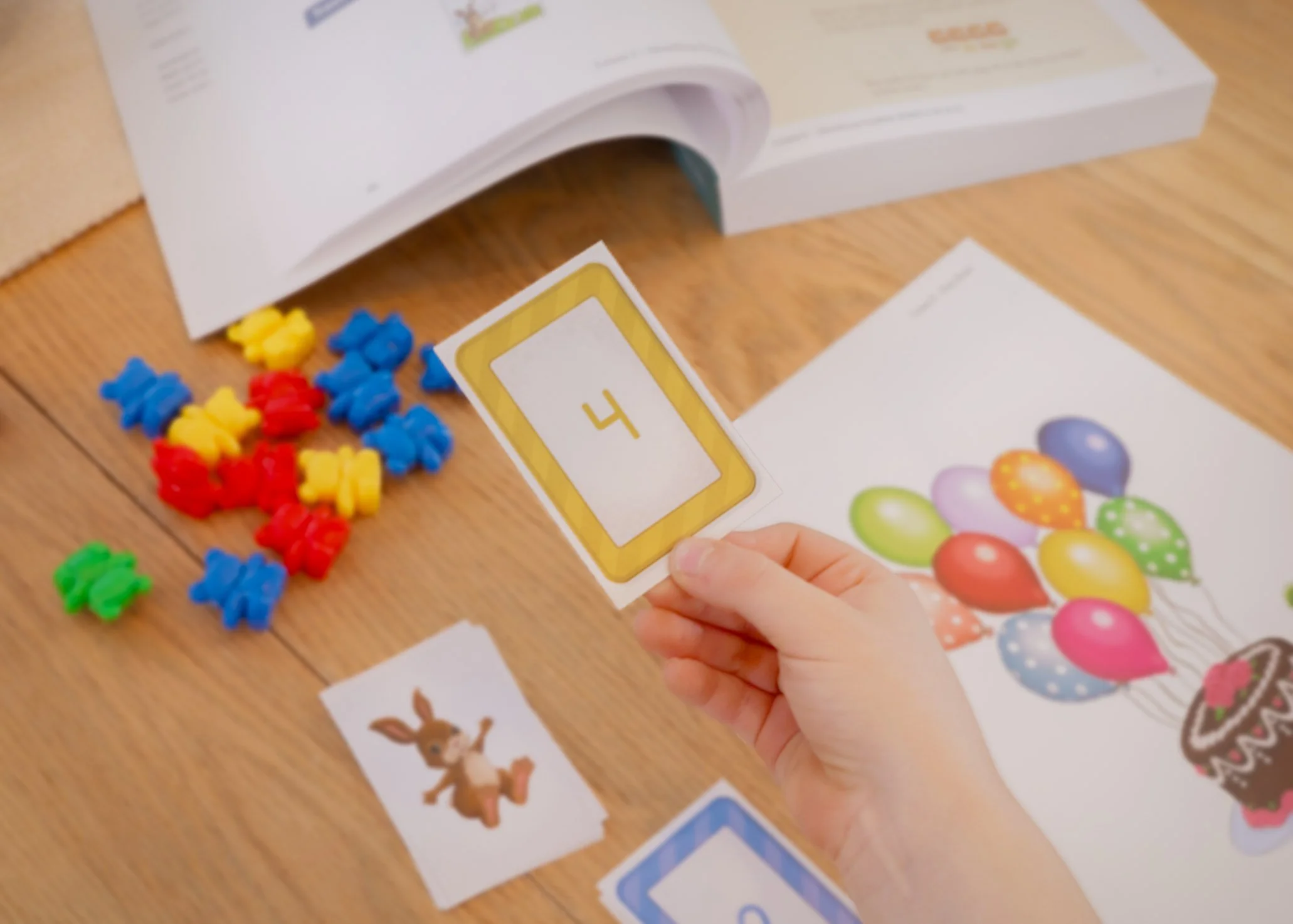 a child holding a math flash card for better learning
