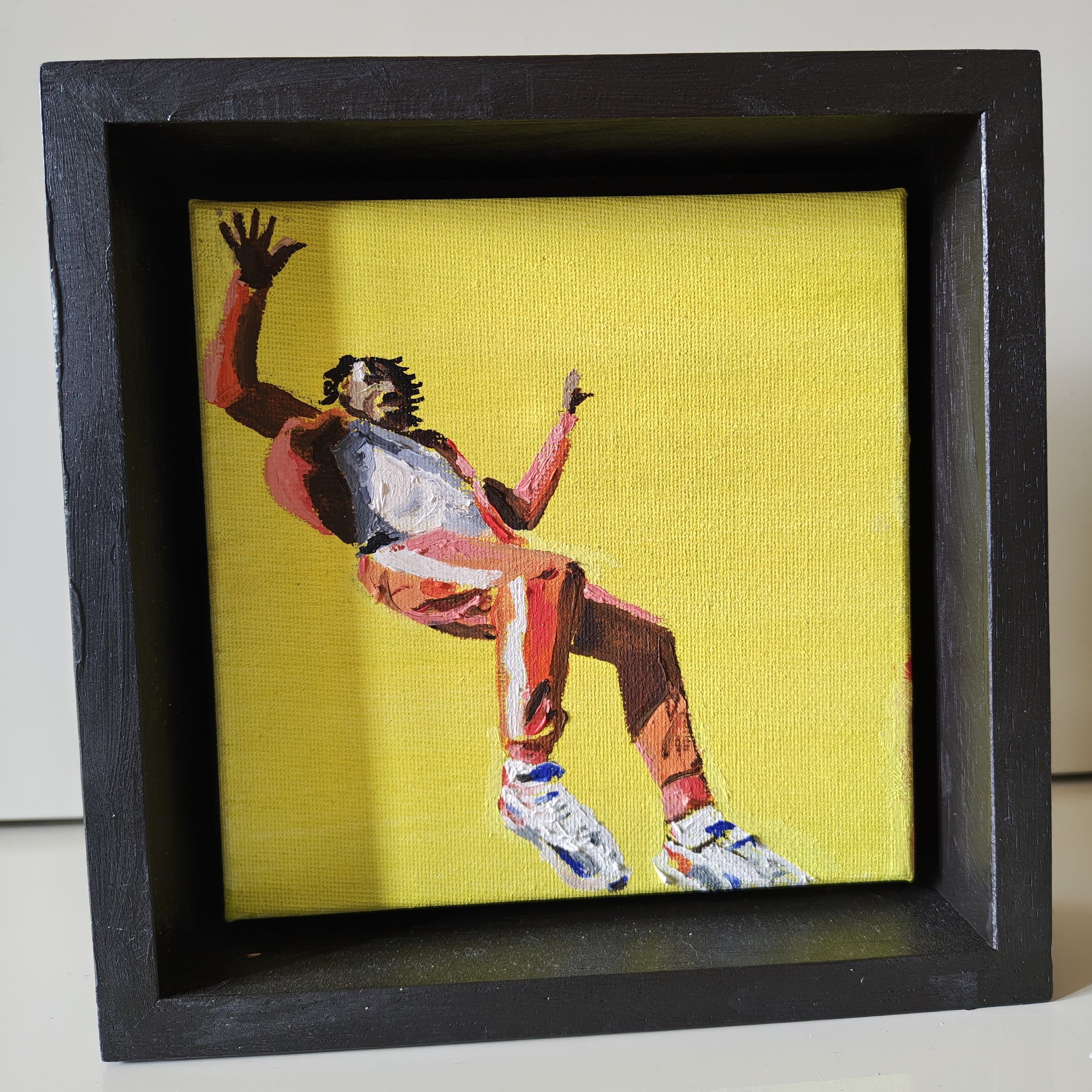 Canvas mounted in a black tray frame