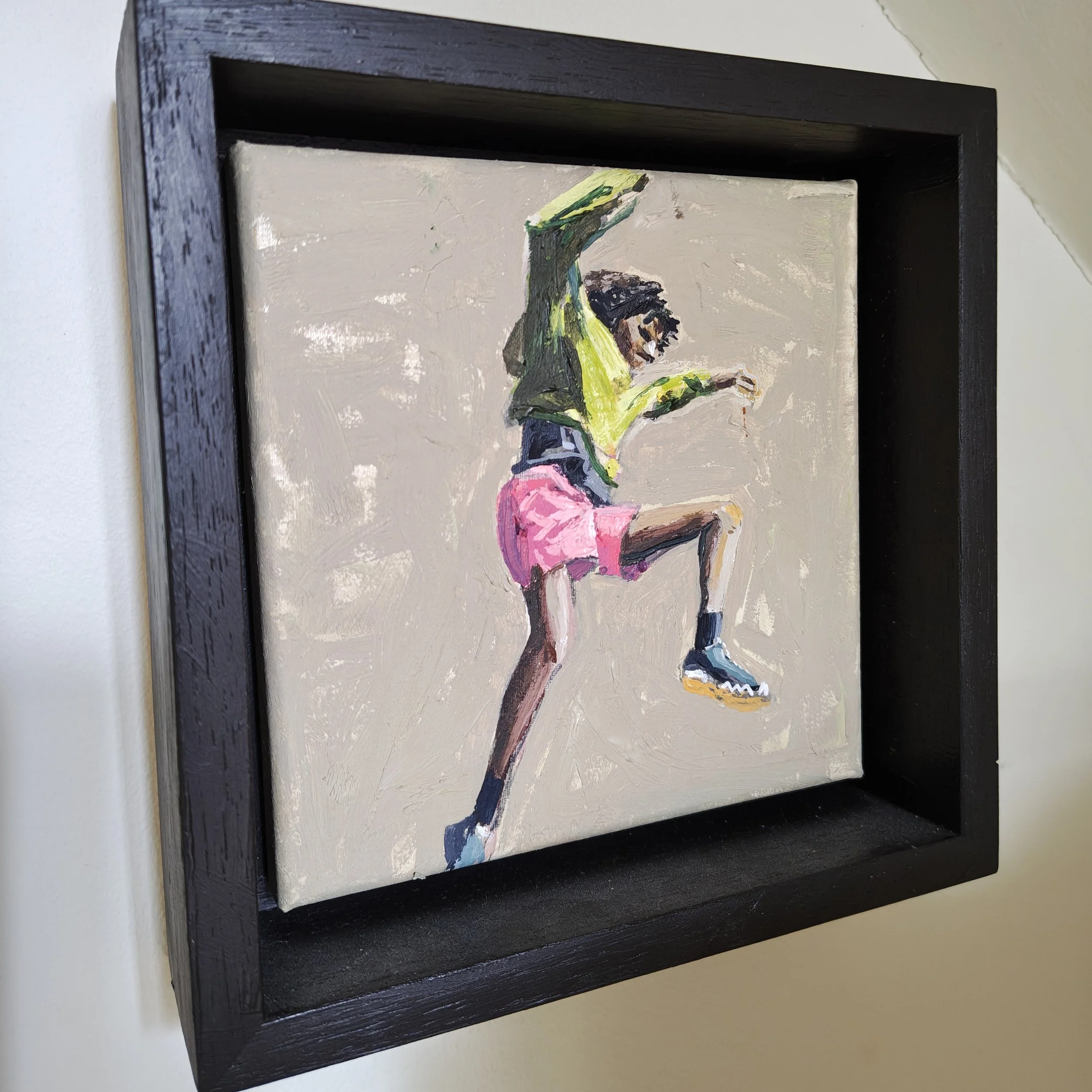 Canvas mounted in a black tray frame