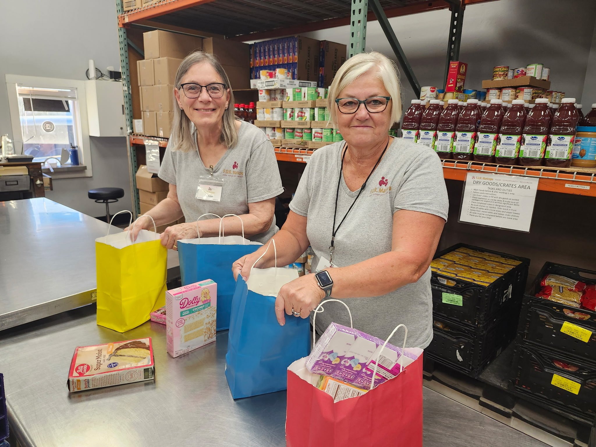 Volunteers building birthday bags