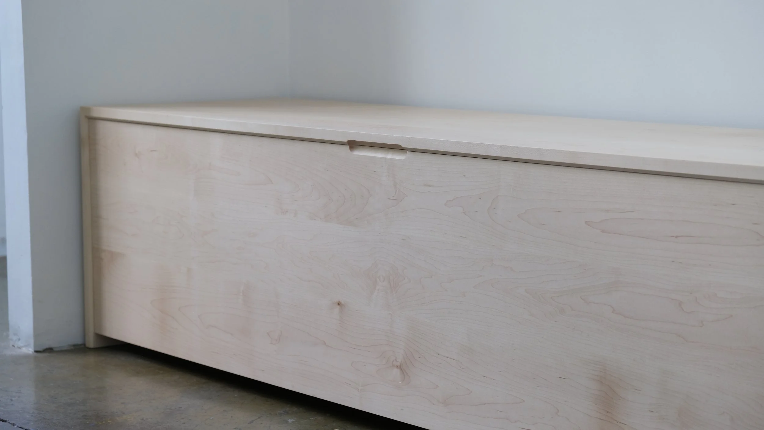 Custom banquette trunk storage for a client that did not have seating at their dining table.
