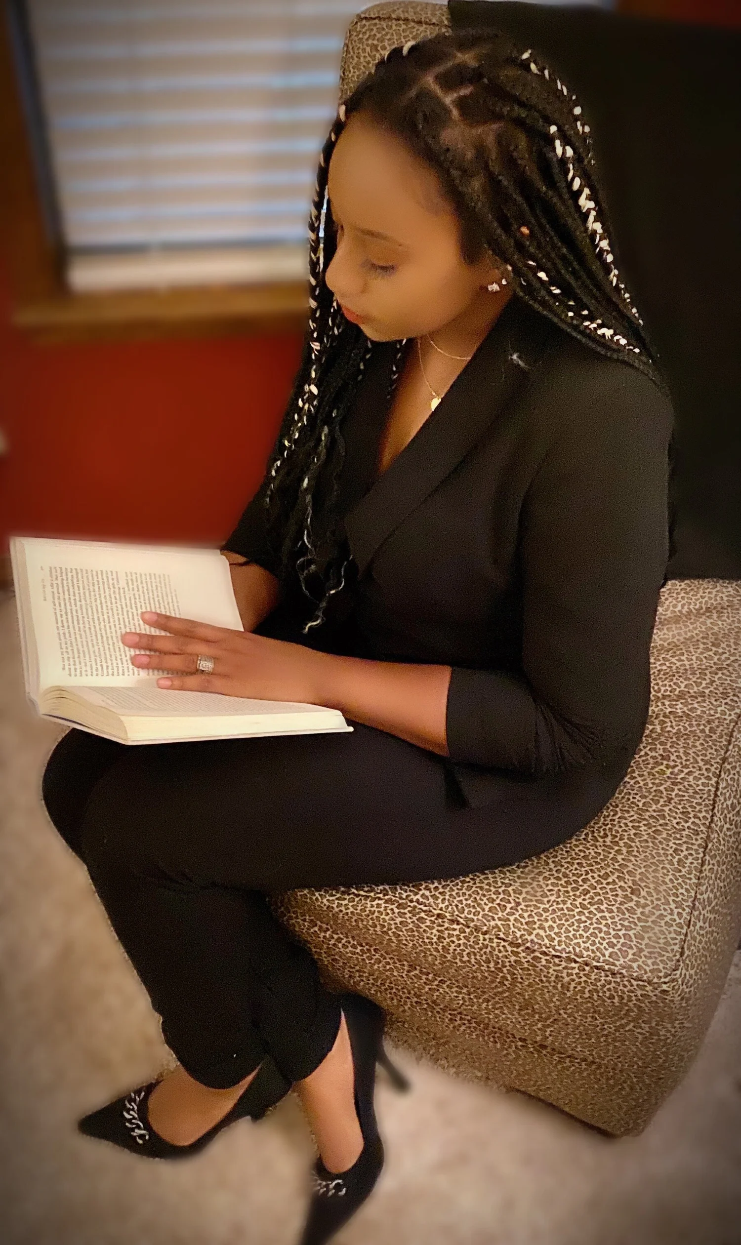 Lamesa Fleury seated and reading a book