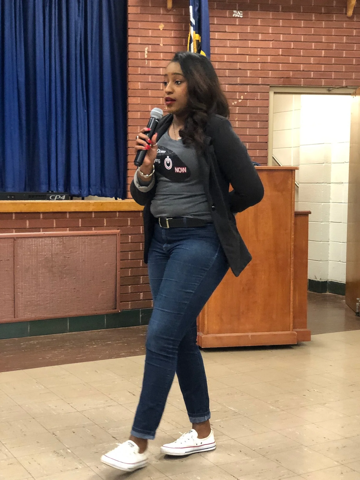 Lamesa Fleury speaking with a microphone at a community event
