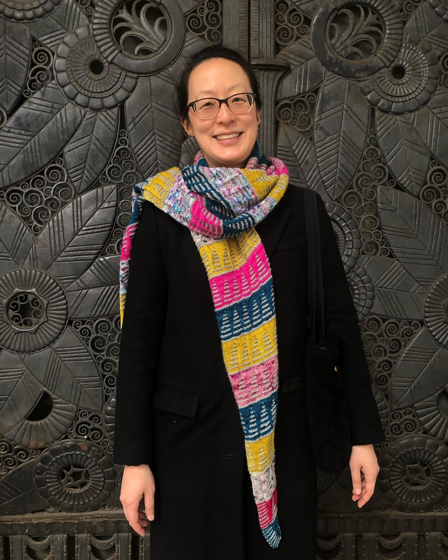 I knit this oversized scarf and have been wearing it with my long winter coat. The colorful yarn came bundled in one &ldquo;Mixed Lot of Leftover Yarn&rdquo; bag from eBay, and I like to think that someone out there is wearing a scarf in the same col