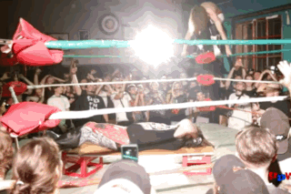 Rob Scaffold launches himself from the top rope with an impressive aerial maneuver.